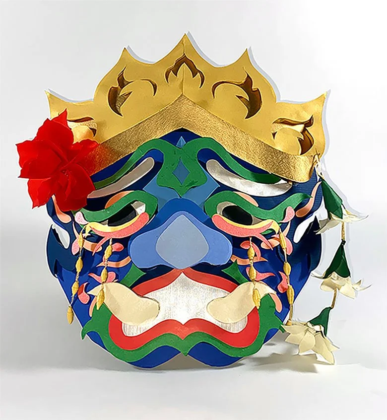 Weeping Demon is inspired by Cambodian masked theater known as Lakhon Khol. It depicts a female demon weeping for what was lost, embodying the grief and pain left behind by the Cambodian genocide. The details are rendered in cut paper.