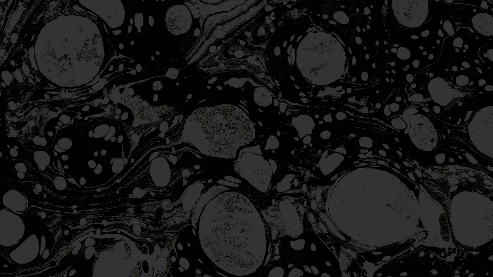 Abstract black and gray pattern with various circular shapes and swirls.
