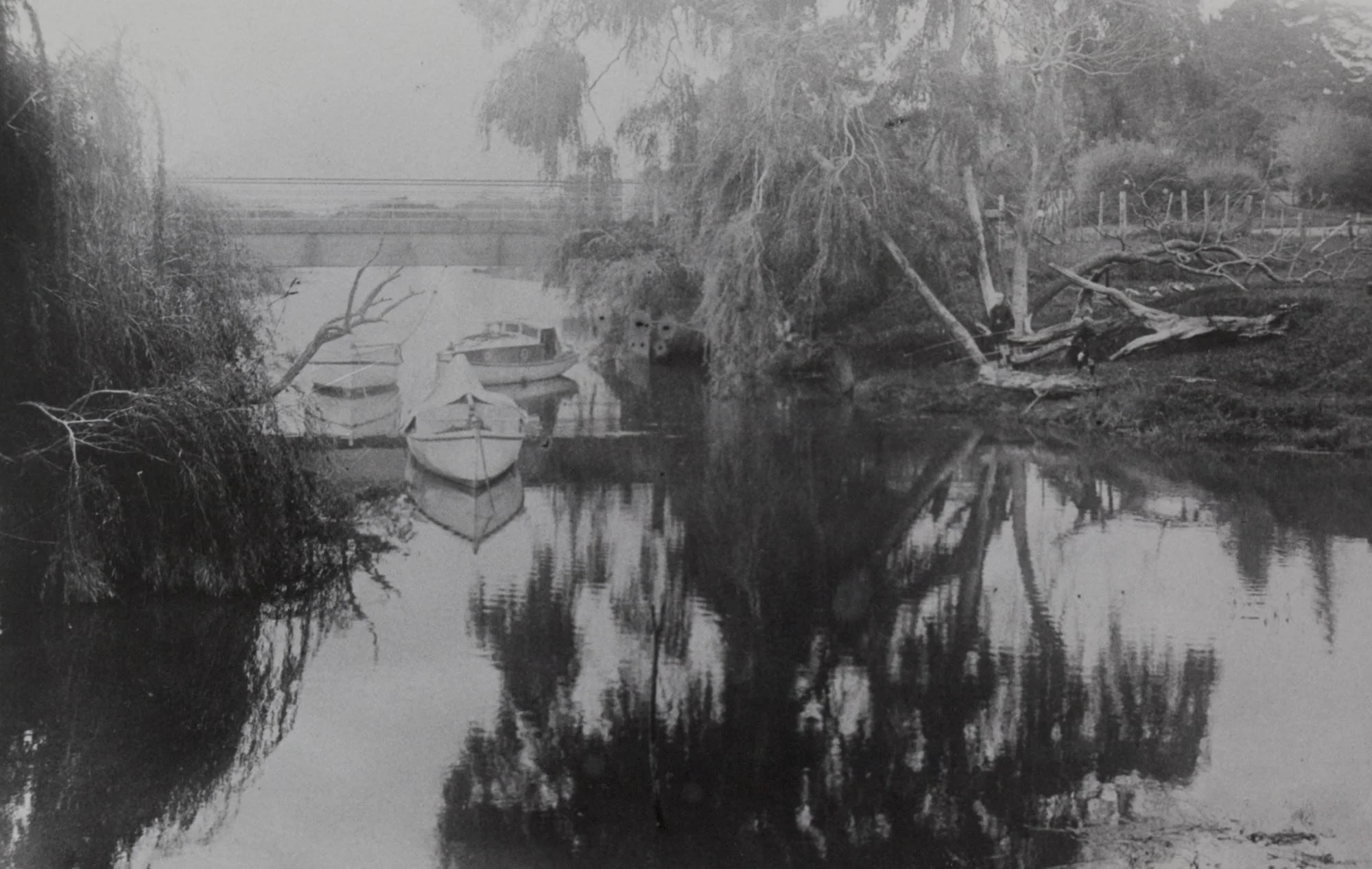 Boats moored in the Wairoa River near the old Clevedon Wharf Bridge, 1908