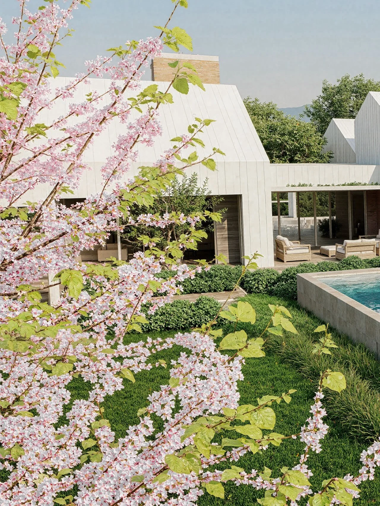 House C is designed for acreage living.
Two gabled structures with sloped ceilings frame generous interior spaces, connected by a pavilion-style gallery entry with timber reveals. The home includes five bedrooms, multiple living areas, an arrival cou