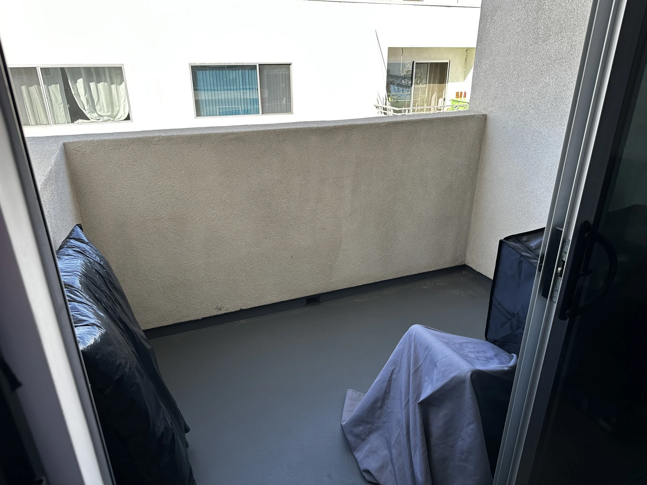 Before photo of empty apartment balcony