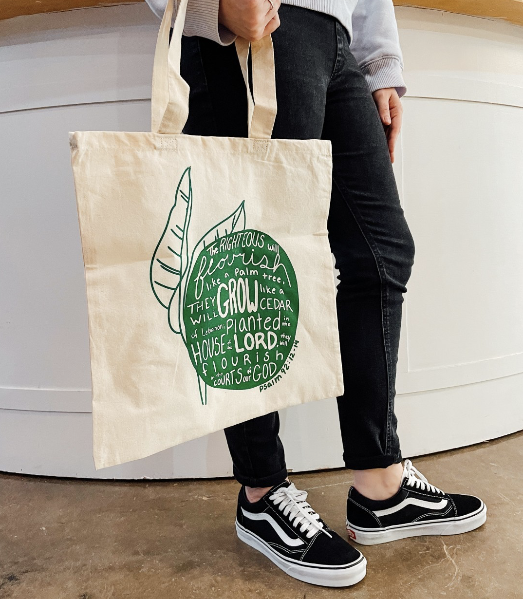 Graphic designed for merchandise for a women's event where the theme was to grow and flourish. The main bible verse was used in negative space with the green.