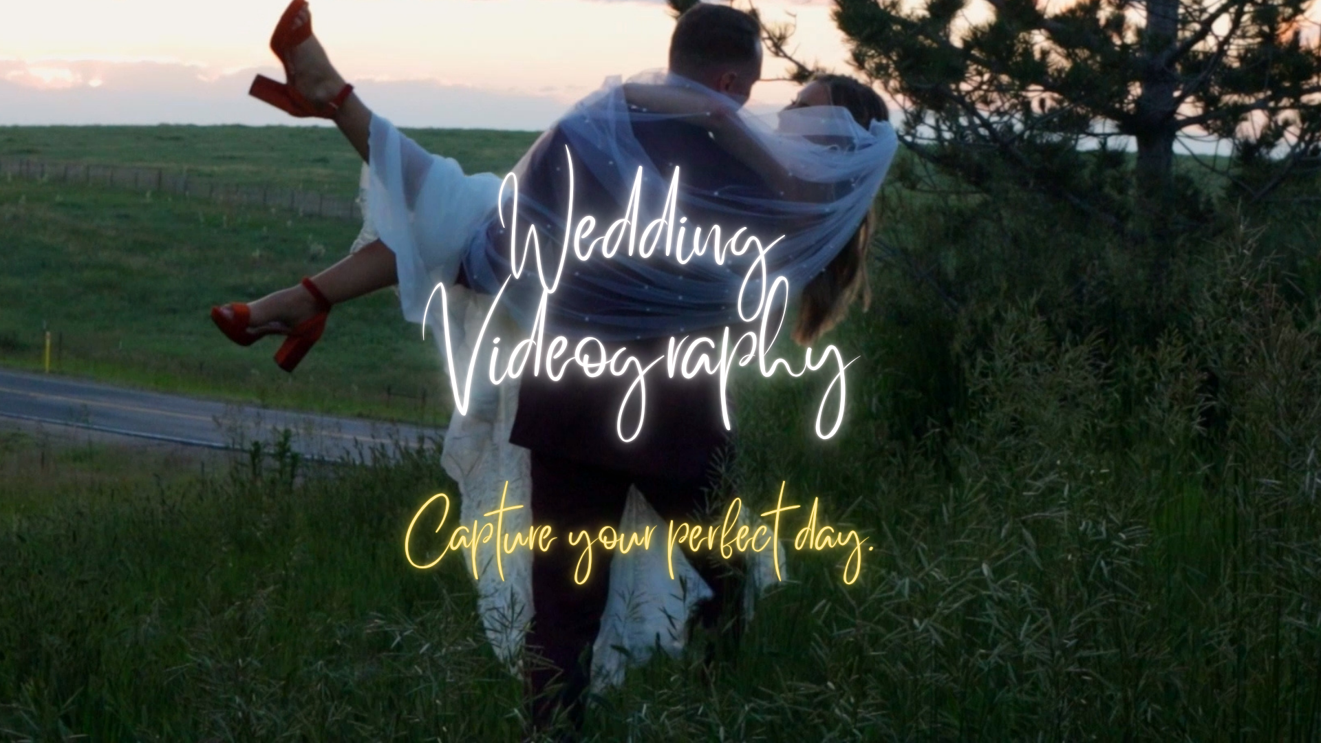 A couple dressed as bride and groom in wedding attire in an outdoor field at sunset, with neon overlay text that reads 'Wedding Videography' and 'Capture your perfect day.'