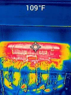 Thermal image of electronic equipment emitting heat, with temperature reading of 109°F at the top.