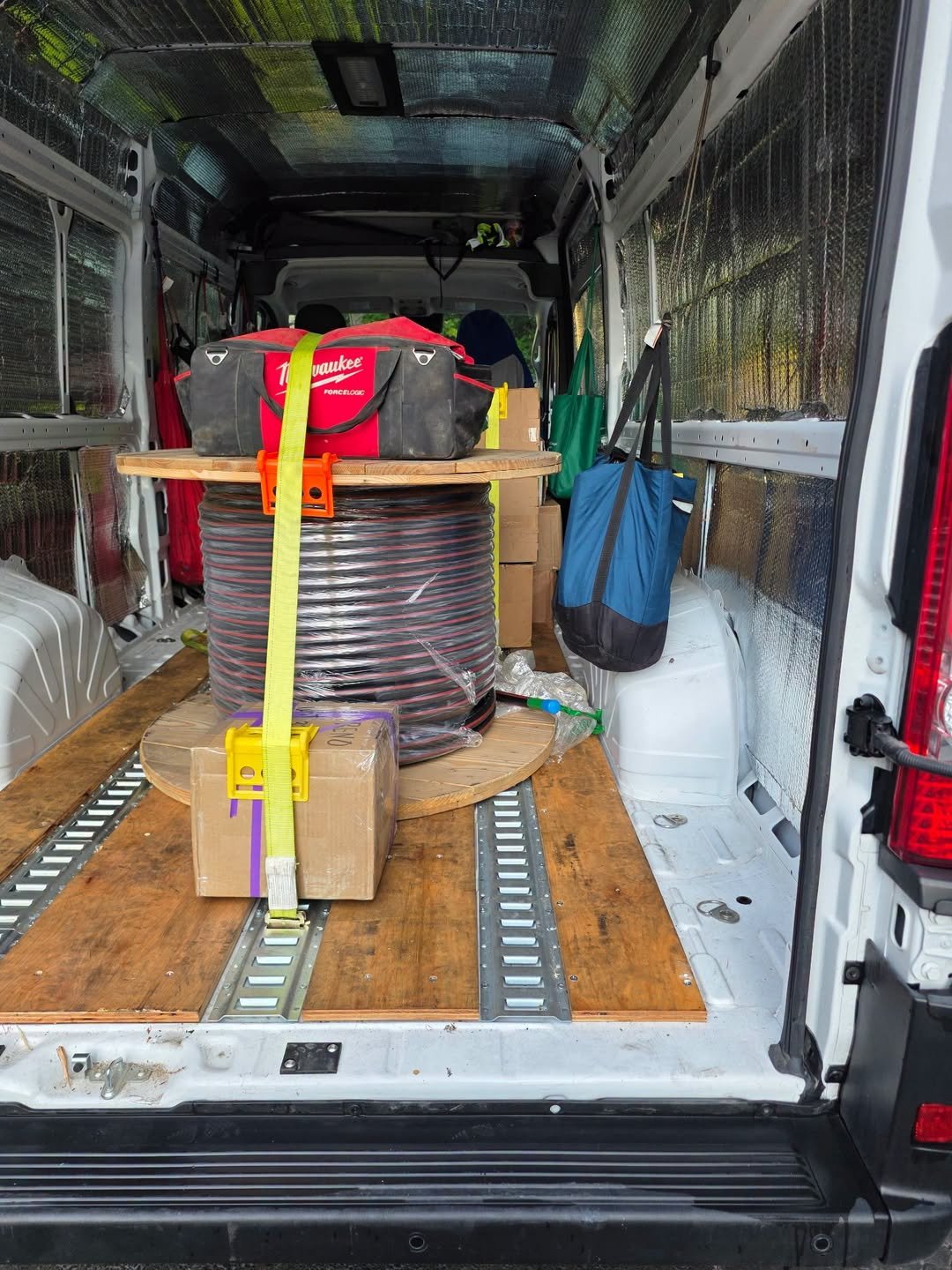 Sprinter van loaded with commercial equipment and supplies for expedited freight transportation and nationwide delivery.