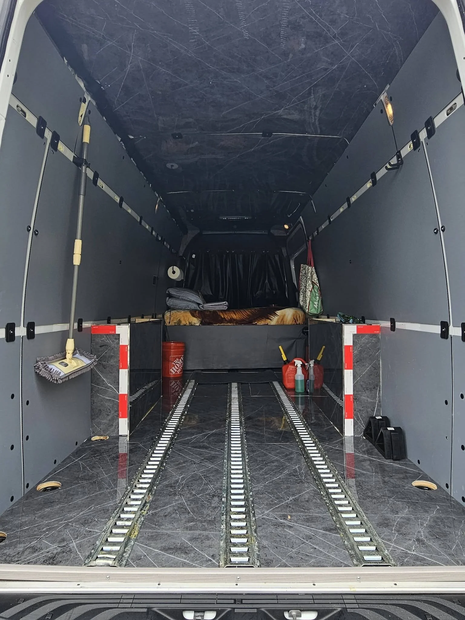 Empty cargo van prepared for expedited freight transportation with a clean, organized cargo area ready for commercial shipments and time-sensitive deliveries.