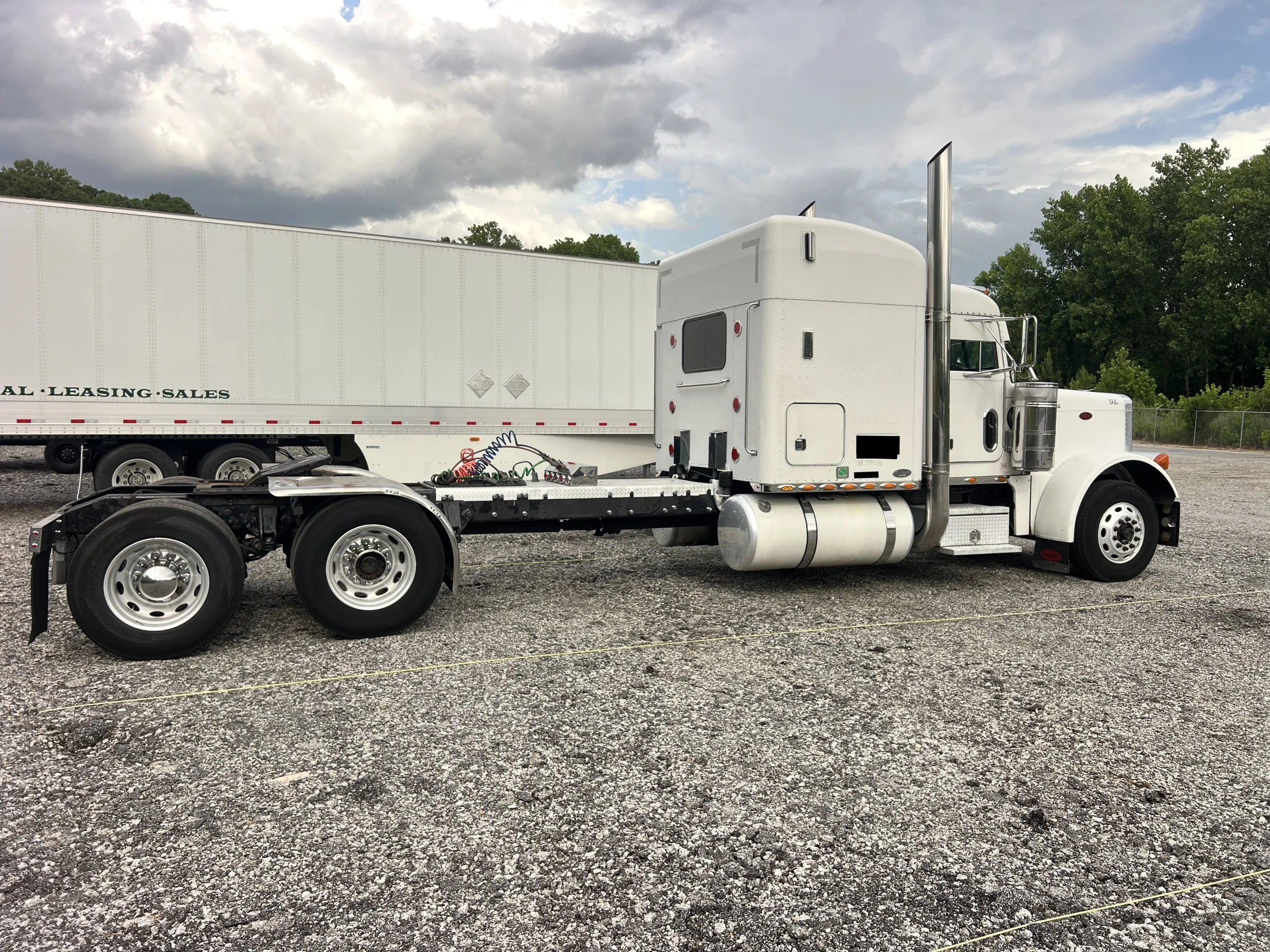 2003 Peterbilt 379 passenger side showing CAT 3406E truck for sale