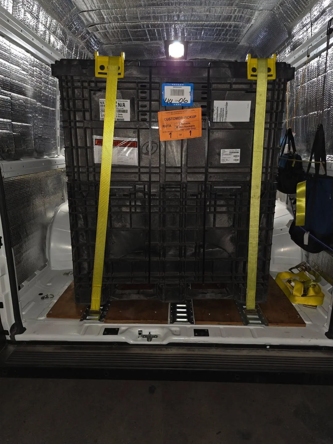 Sprinter van transporting secured commercial cargo for time-sensitive expedited freight delivery across the United States.