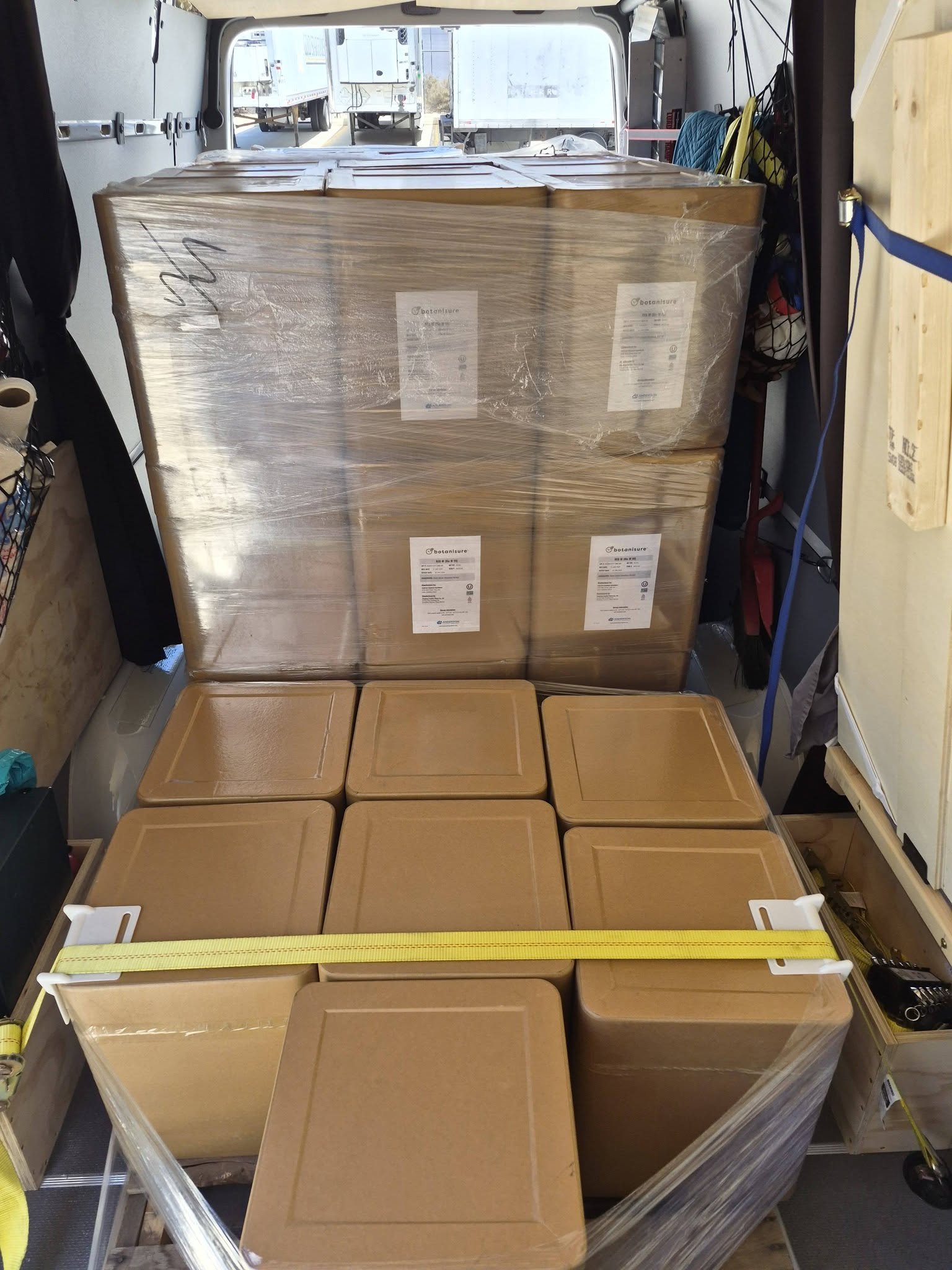 Freight securely loaded and strapped inside a TurboX Logistics Sprinter van for safe expedited transportation and time-sensitive delivery.
