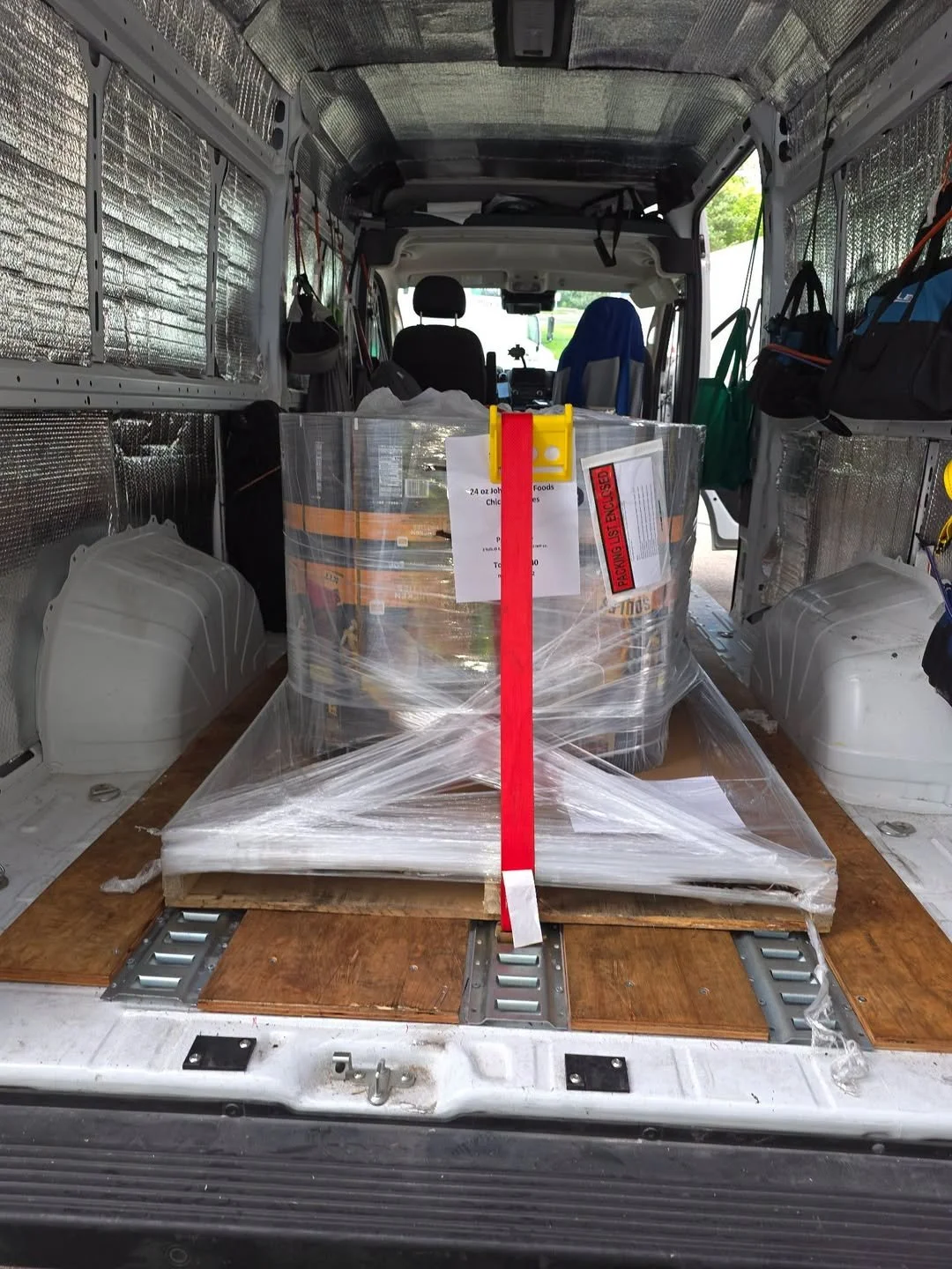 Sprinter cargo van loaded with palletized freight and supplies for fast, dedicated nationwide delivery service.