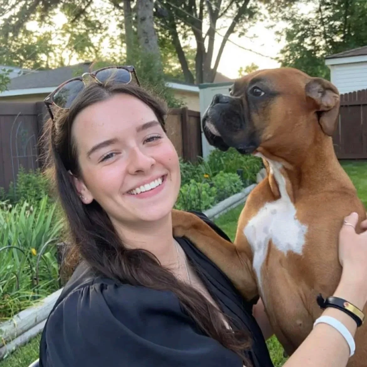 Dr. Koszczuk smiling with her dog