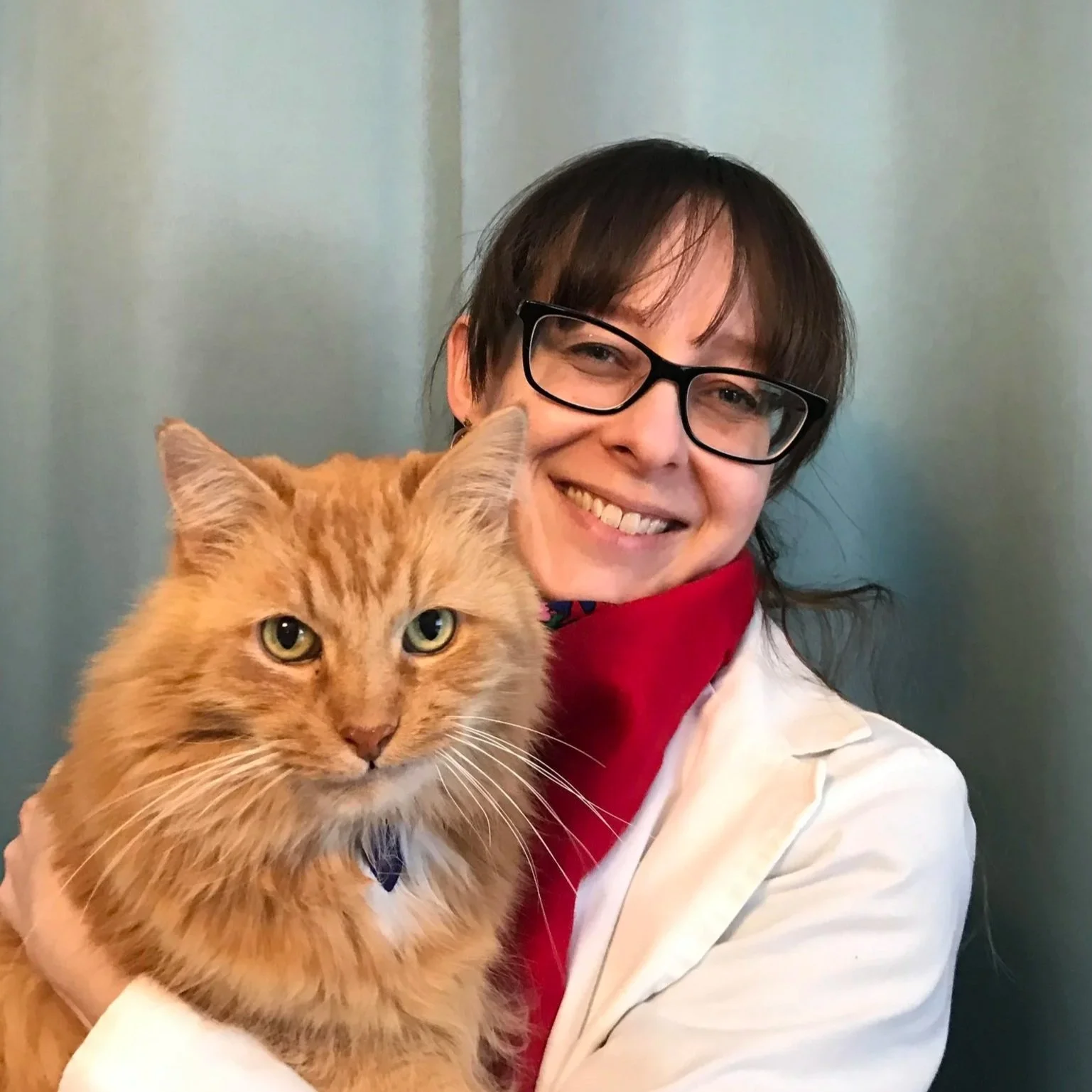 Dr. Weeg smiling with her cat