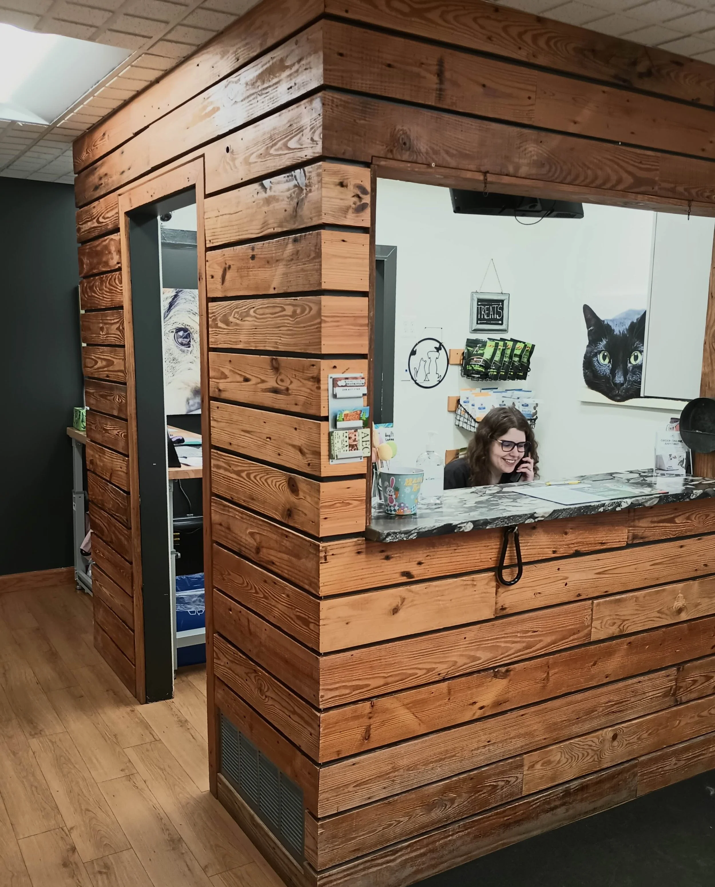 Emily at the Front Desk of Dandy Acres Animal Hospital