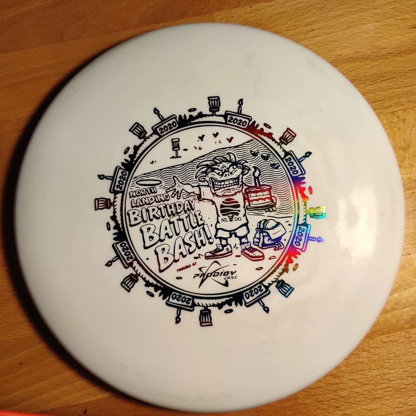 A custom-stamped disc for the first North Landing Birthday Bash.