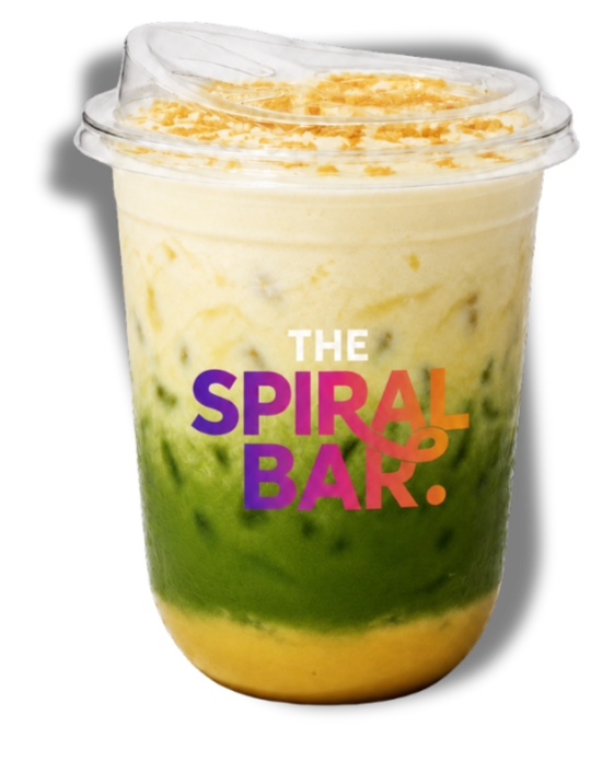 A layered matcha and vanilla-flavored beverage in a clear plastic cup with a clear lid, branded with 'The Spiral & Bark' in colorful text.