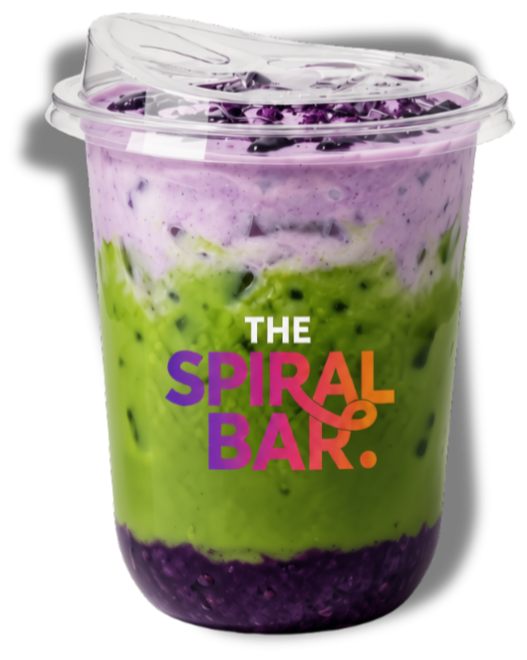 A clear plastic cup filled with layered purple and green smoothie or yogurt with a purple swirl on top, branded with 'The Spiral Bar' logo in purple, orange, and white.