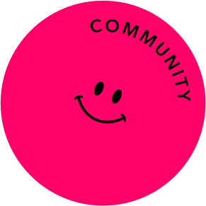 Round pink button with a laughing smiley face and the text 'COMMUNITY' in black lettering.