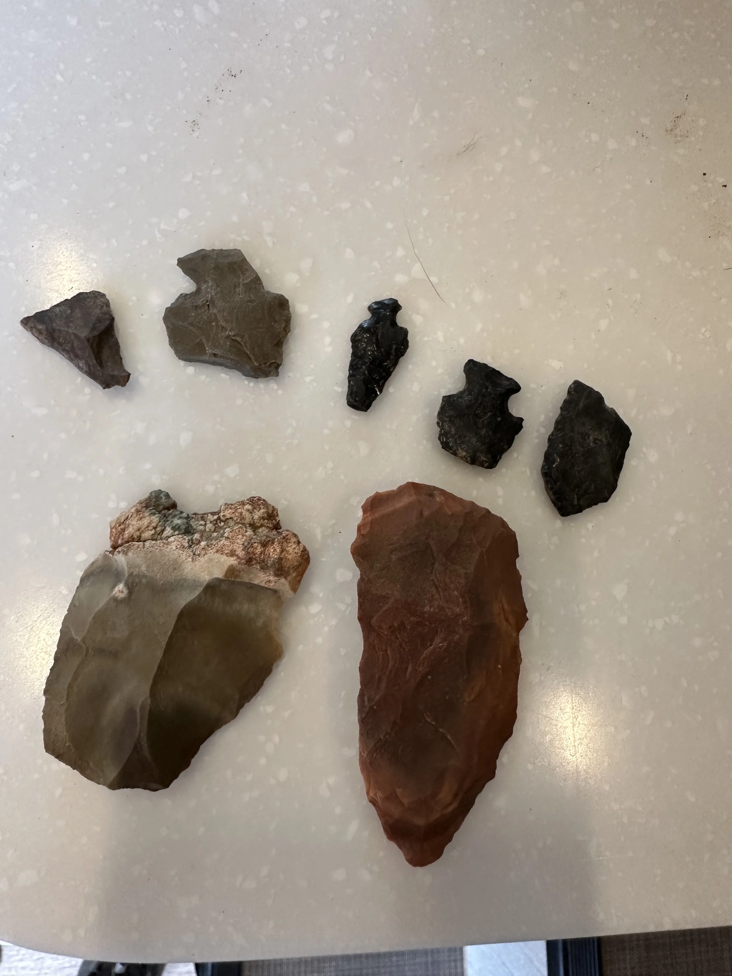A collection of various stone tools and points found at the ranch.