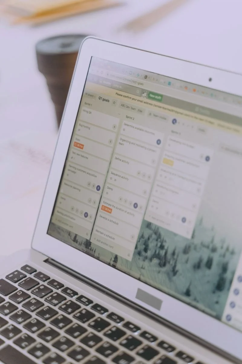 Laptop screen displaying a project management or scheduling application.