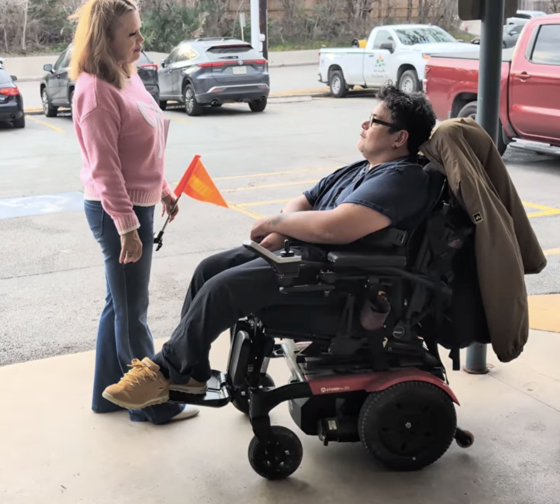 Video link of safety demonstration with wheelchair rider and woman