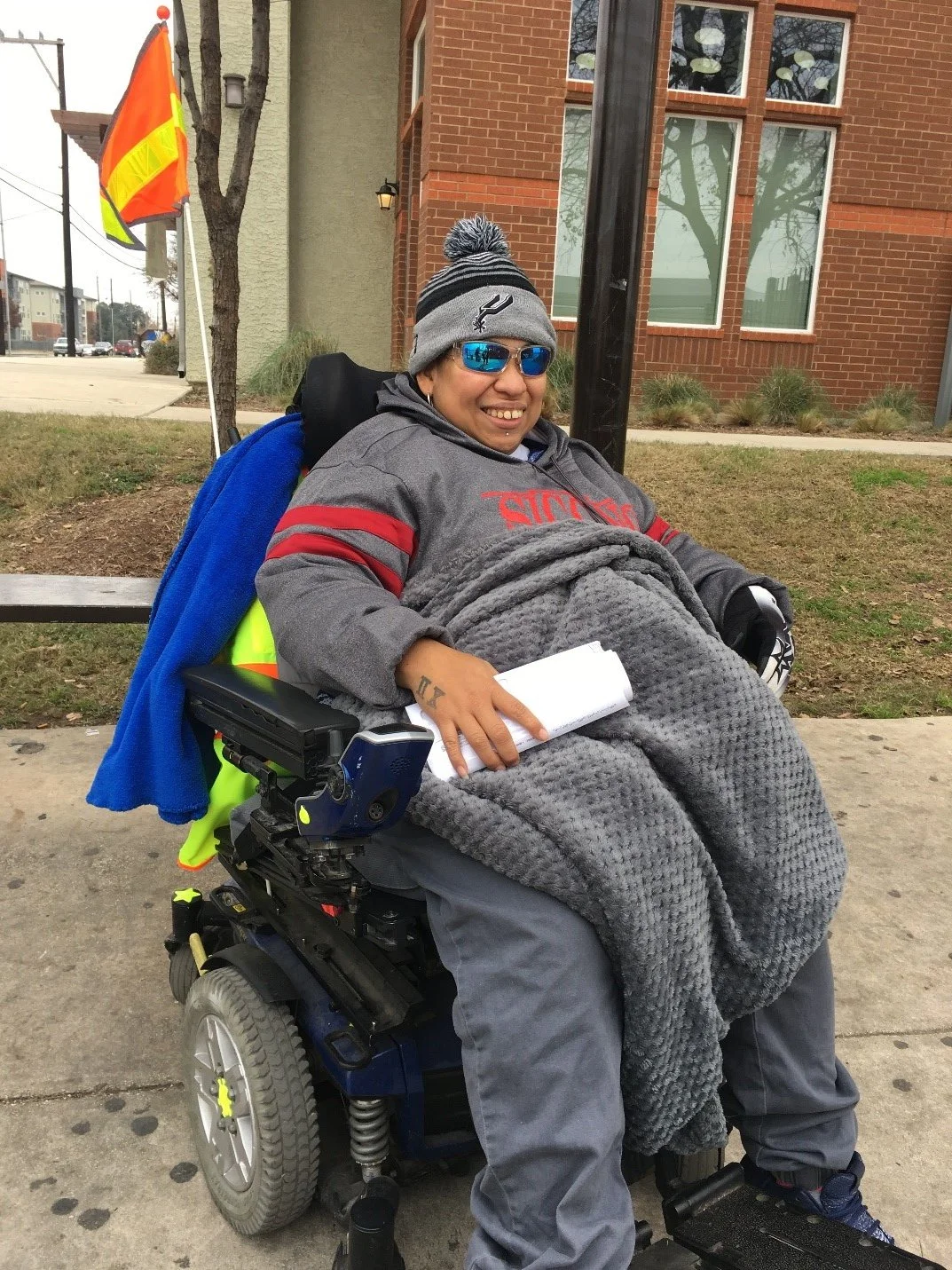 Roseanne hit by a vehicle before receiving a flag.