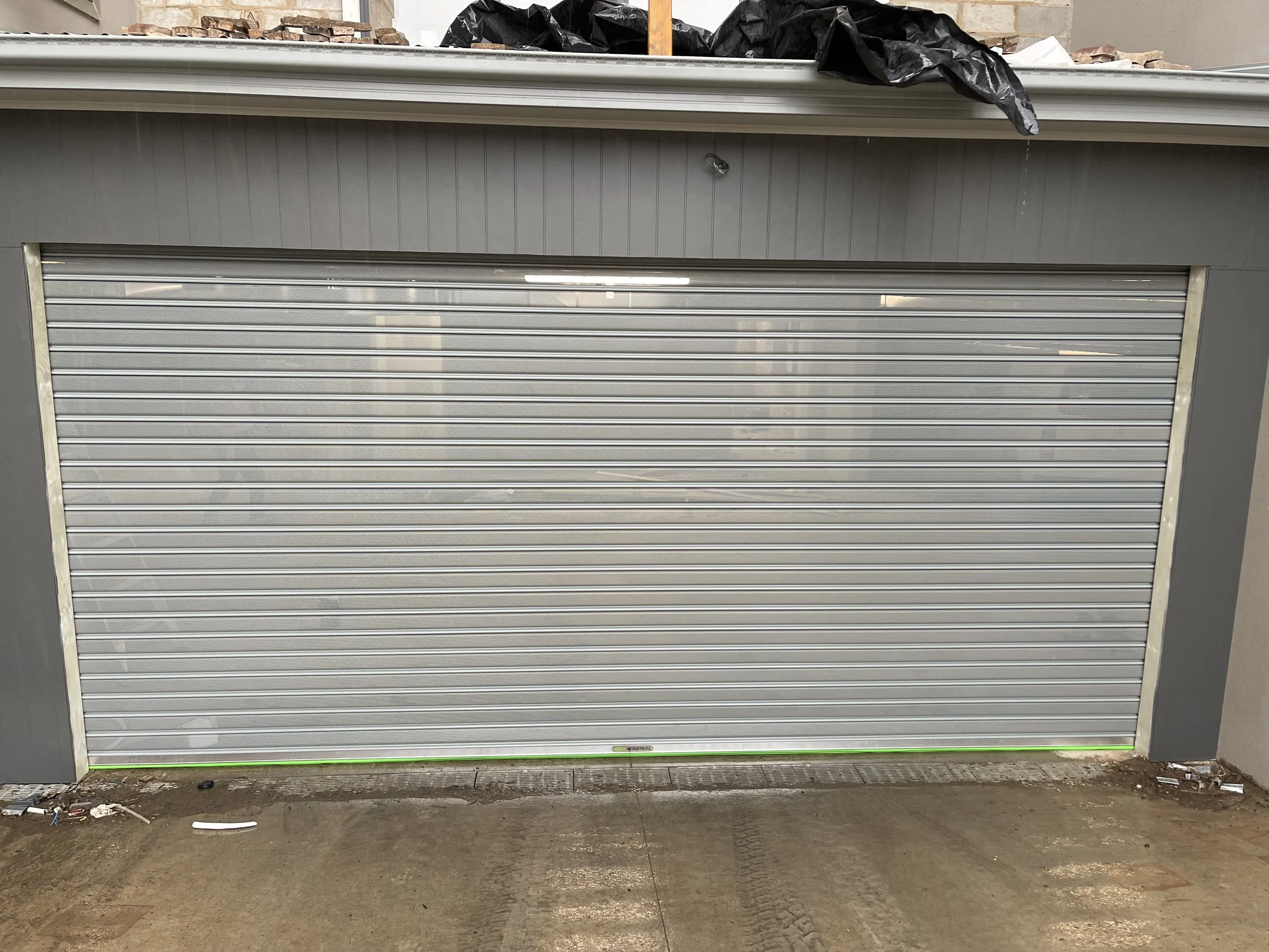 metallic roll-up garage door installation in Rosebud