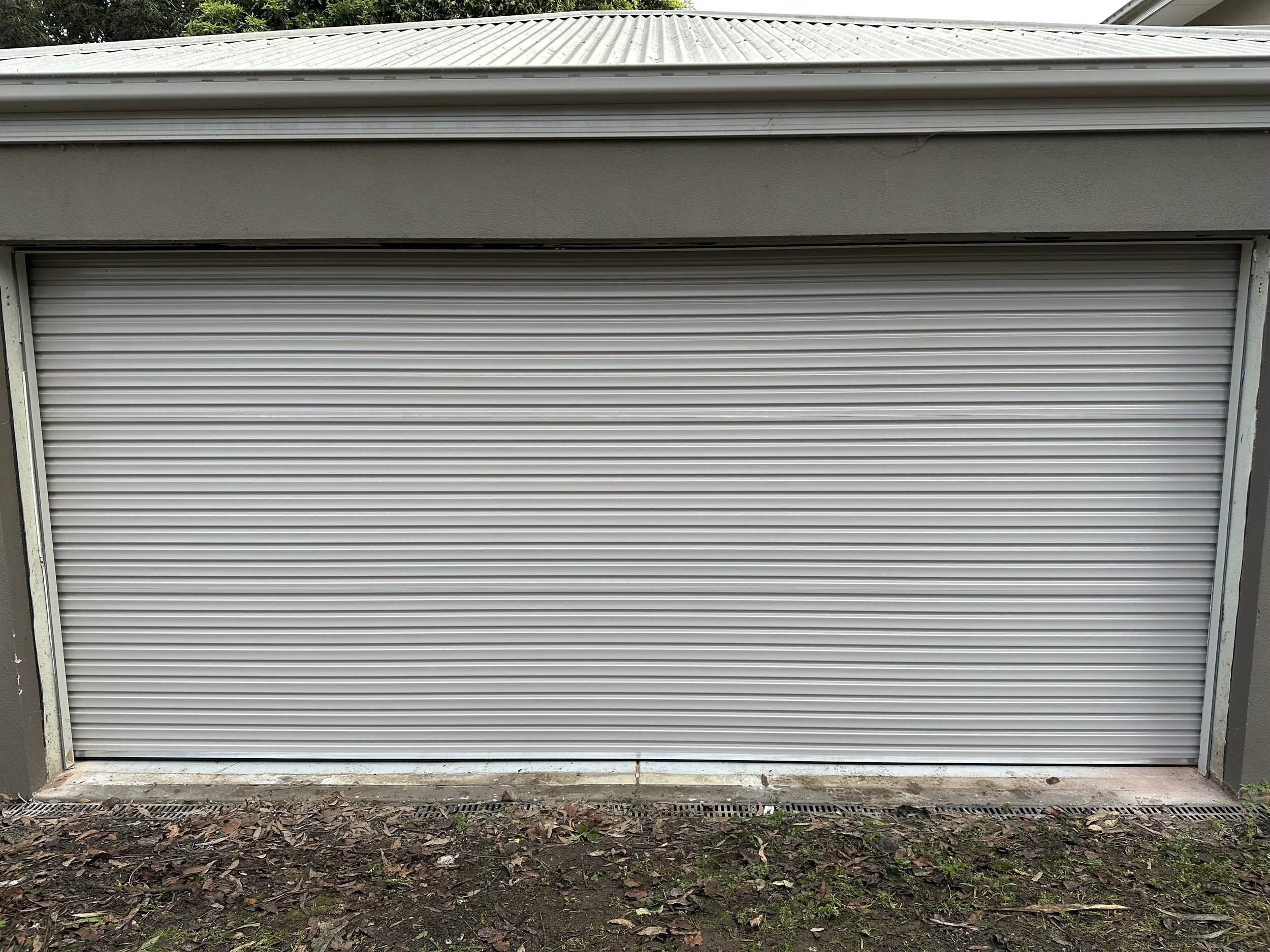 silver metal garage door service in South East Melbourne