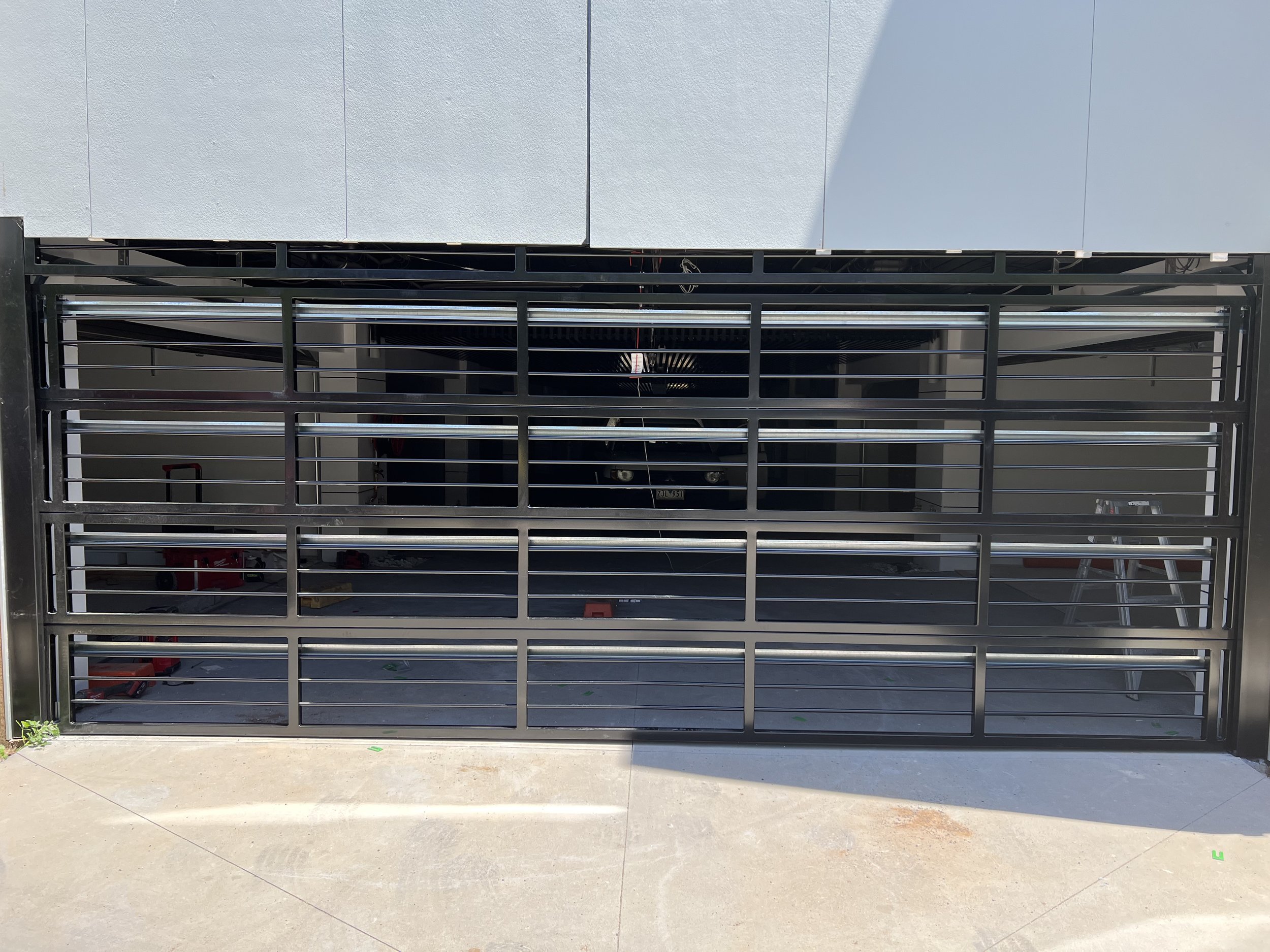 Custom garage door installation with clean finish and alignment