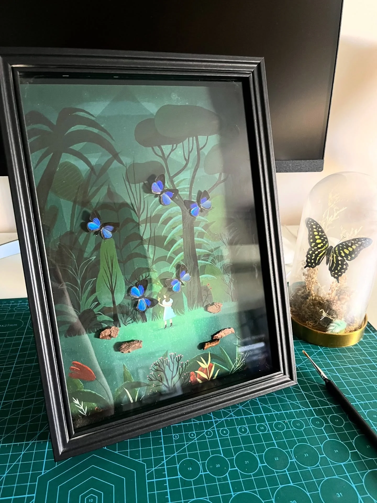 Original illustration &times; real blue hairstreak butterfly specimen 🦋
This piece features 5 iridescent blue butterflies I collected during a trip to Bangkok,Thailand. Their natural shimmer is even more breathtaking in real life.
They circle a litt