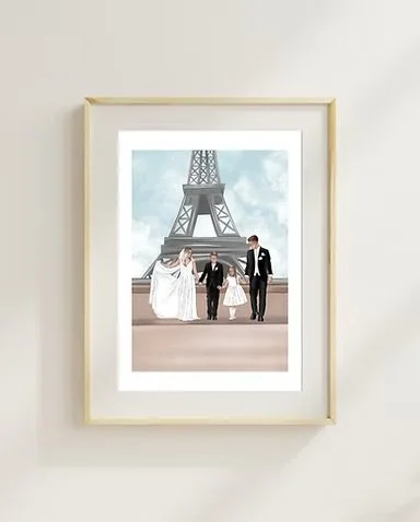 A framed picture of a wedding couple and a child standing in front of the Eiffel Tower in Paris, France.