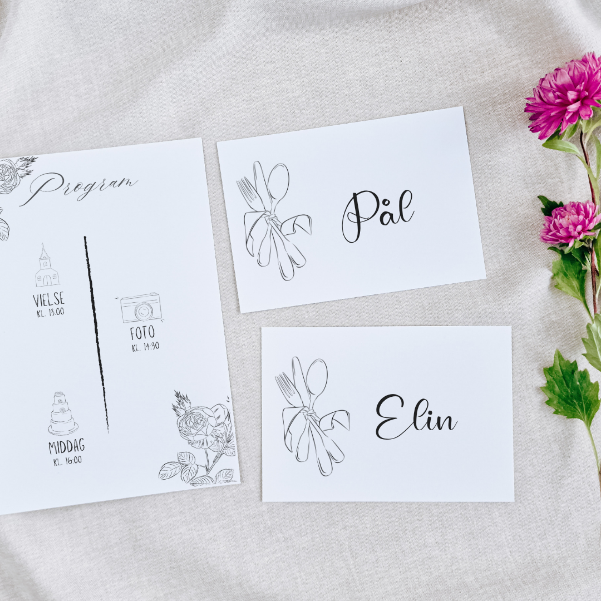 Event place cards with floral and cutlery illustrations, labeled Pål and Elin, and a wedding program with schedule and floral decorations, surrounded by pink flowers on a light-colored tablecloth.