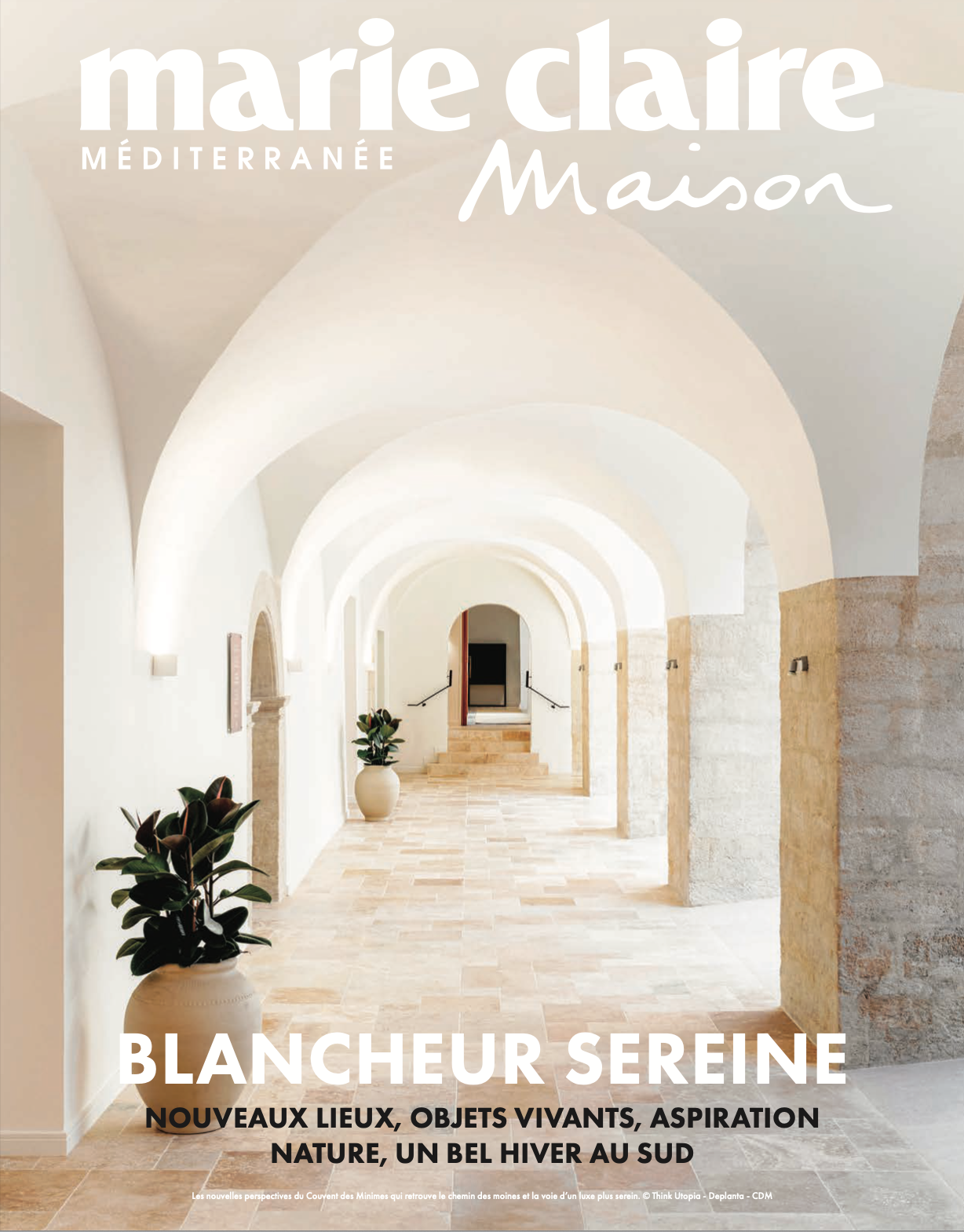 A magazine cover featuring a photograph of a bright hallway with white arches, a beige stone floor, potted plants, and text in French about serenity, nature, and interior design.
