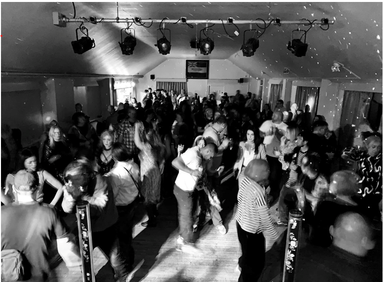 People dancing at a gig at the Marsden Royal British Legion, West Yorkshire.