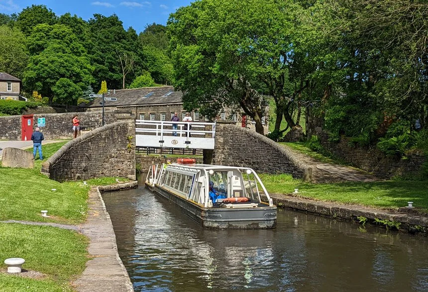 The Canal and River Trust boat sailing in Marsden, West Yorkshire.