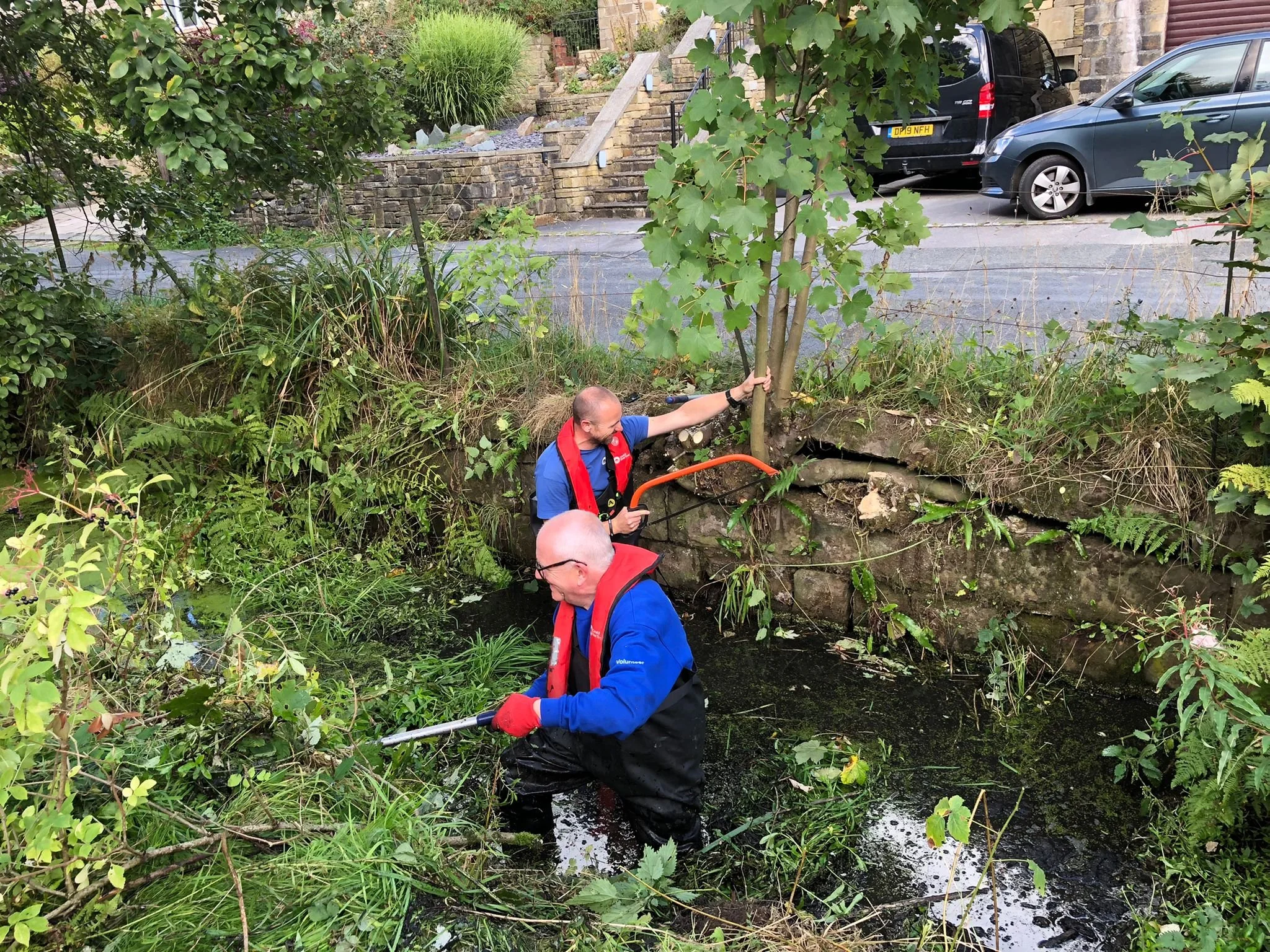 Canal and River Trust volunteers hard at work in Marsden, West Yorkshire.