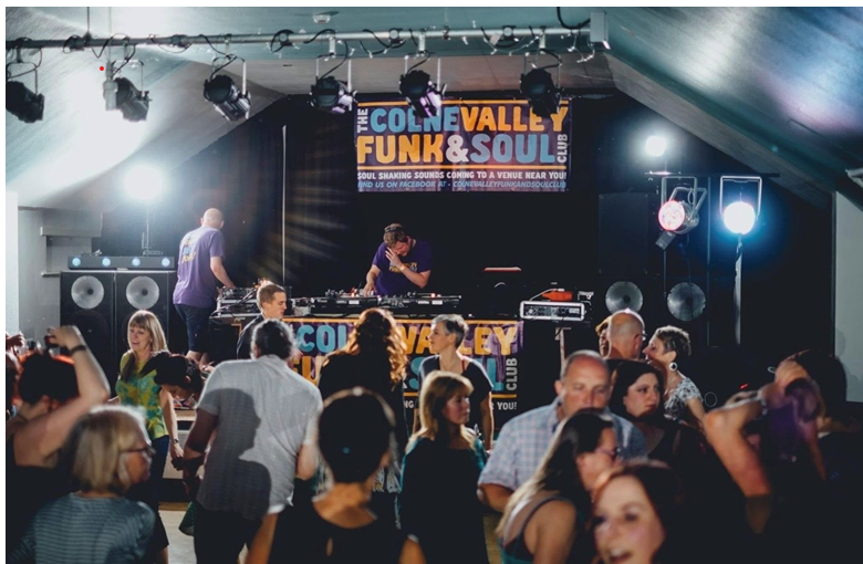 People dancing at a funk and soul night at the Marsden Royal British Legion, West Yorkshire.