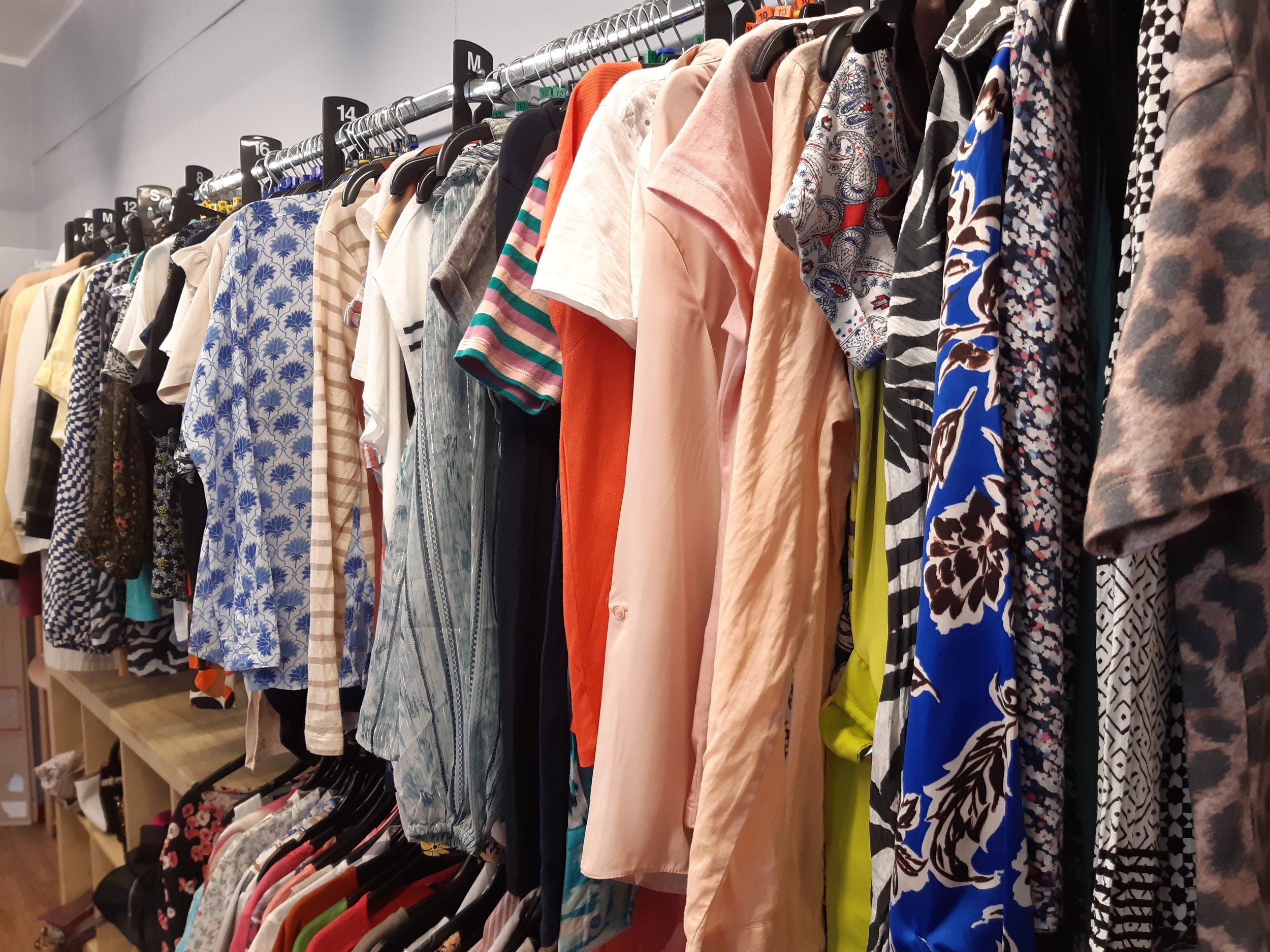 Clothes for sale in the Cuckoo's Nest charity shop in Marsden, West Yorkshire.