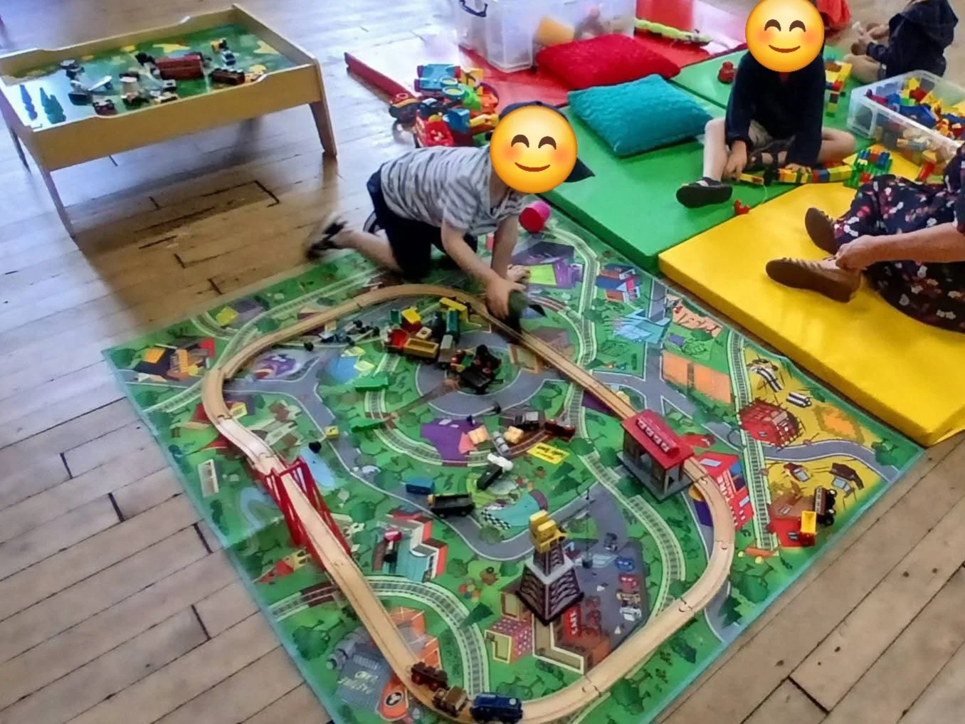 Children playing on mats at Tiny Tots pre-school playgroup in Marsden, West Yorkshire.