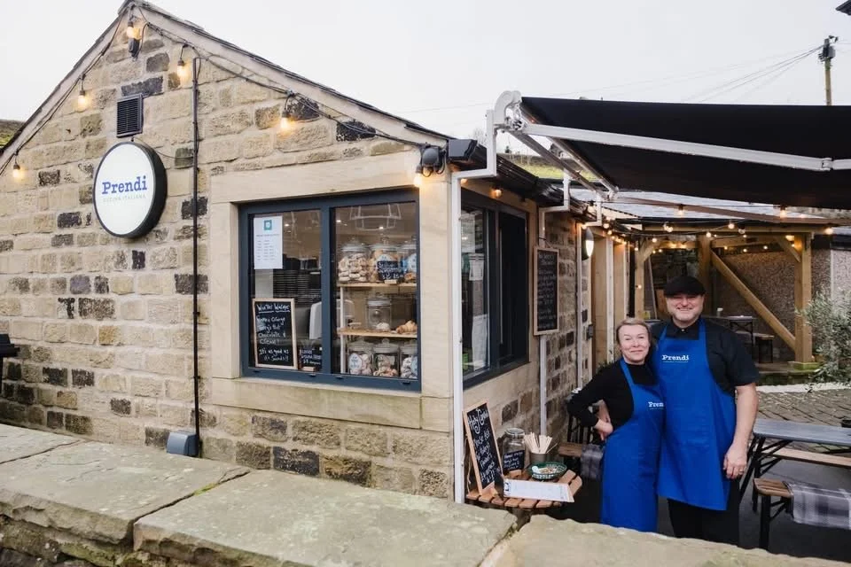 Jules and Mark Bedford standing outside the kitchen of Prendi Cucina Italiana in Marsden, West Yorkshire.