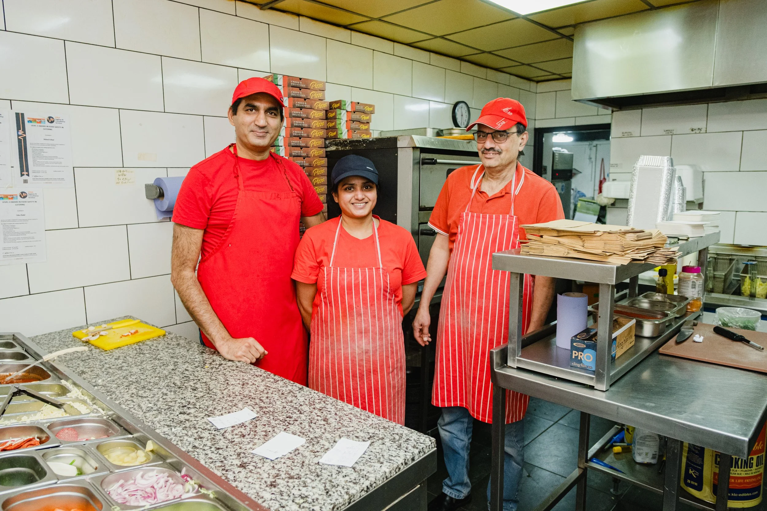 Staff behind the scenes at Marsden Spice and Pizza in Marsden, West Yorkshire.