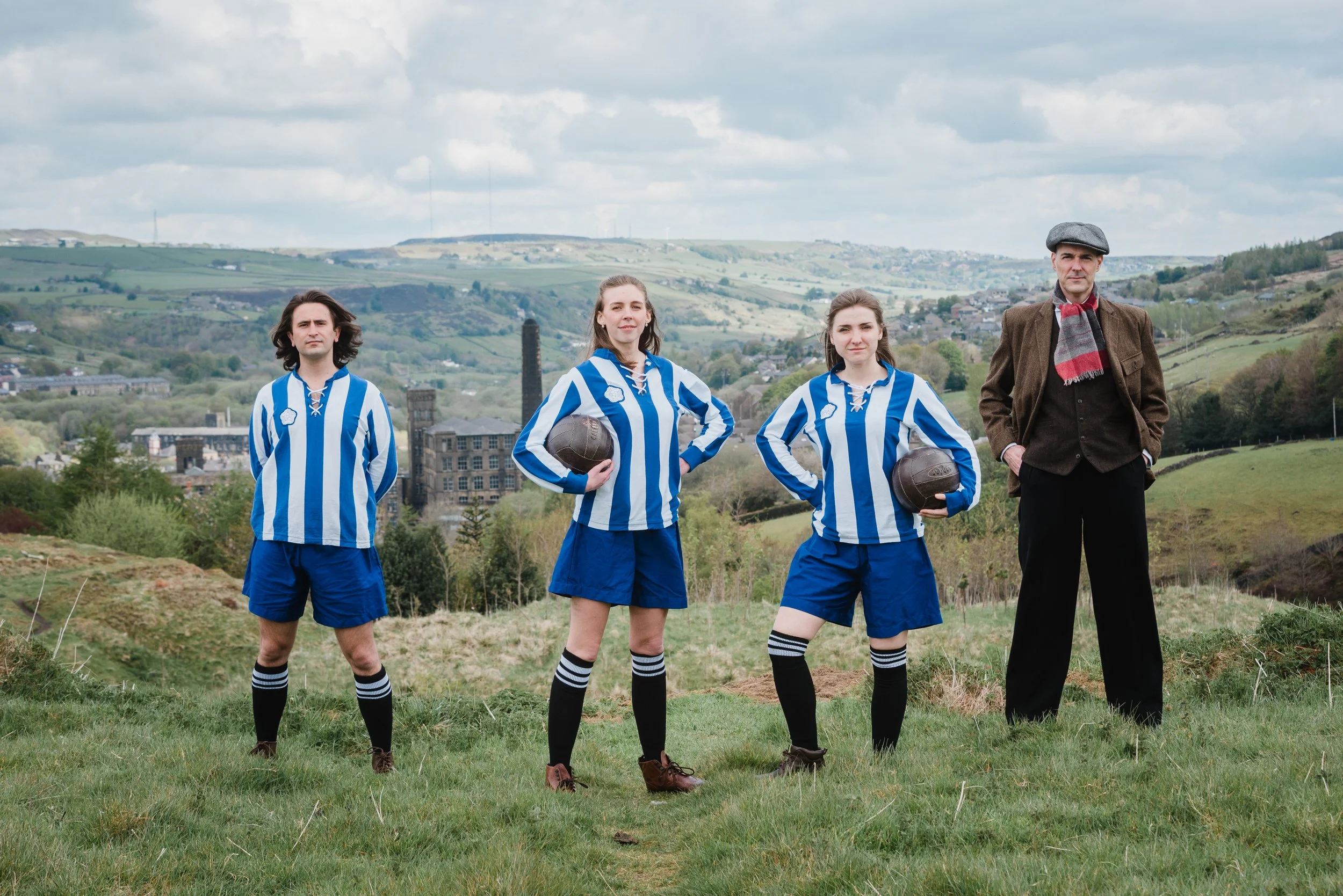 Actors posing for a publicity shot for Mikron Theatre in Marsden, West Yorkshire.