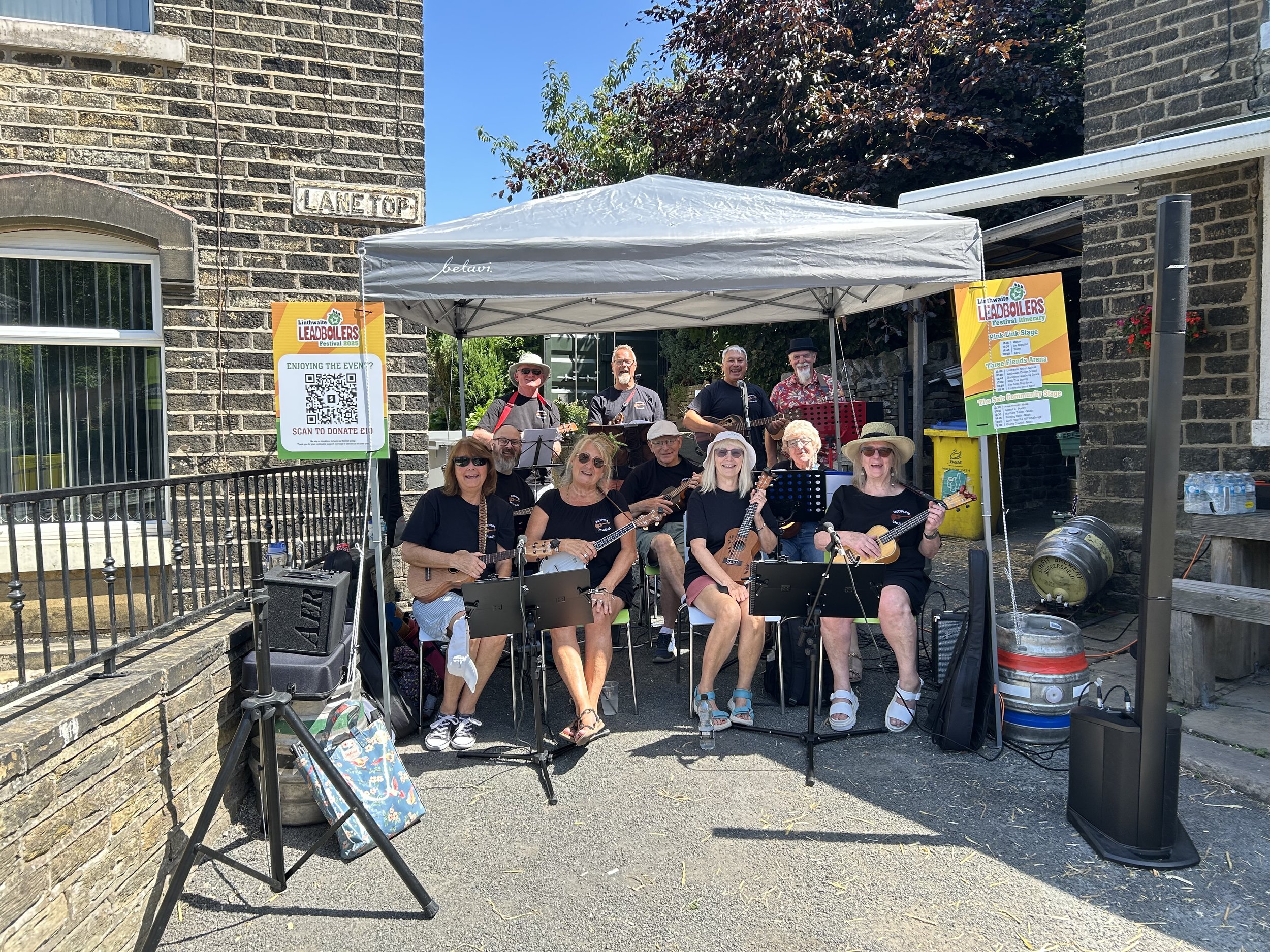 Members of the MUCIPUPS ukulele group gathered ready to perform.