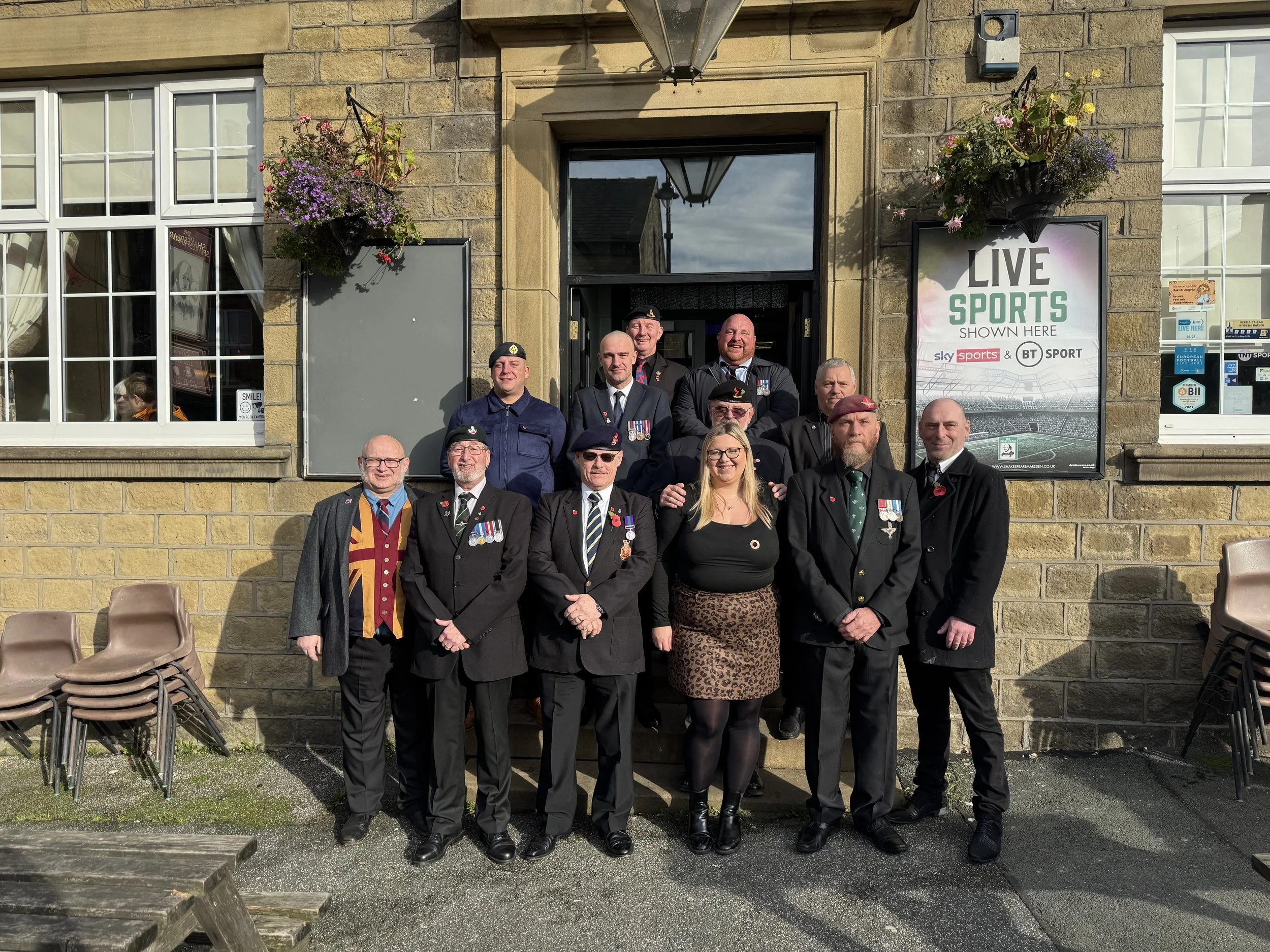 A Remembrance Day group outside the Shakespeare Inn in Marsden, West Yorkshire.
