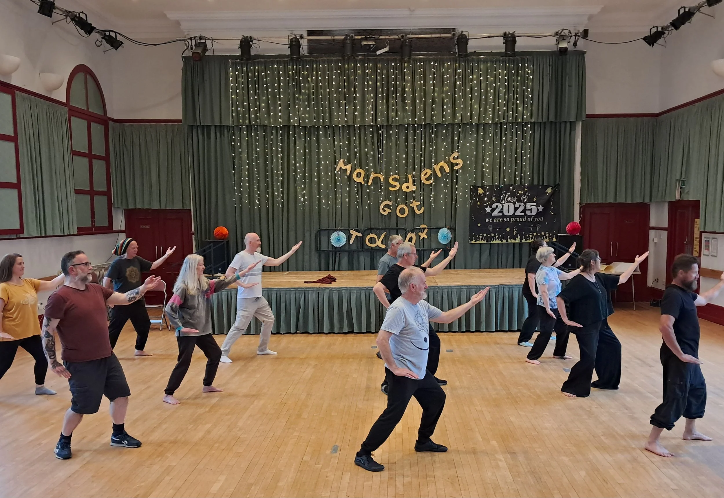 Members of a Tai Chi class in the Marsden Mechanics.