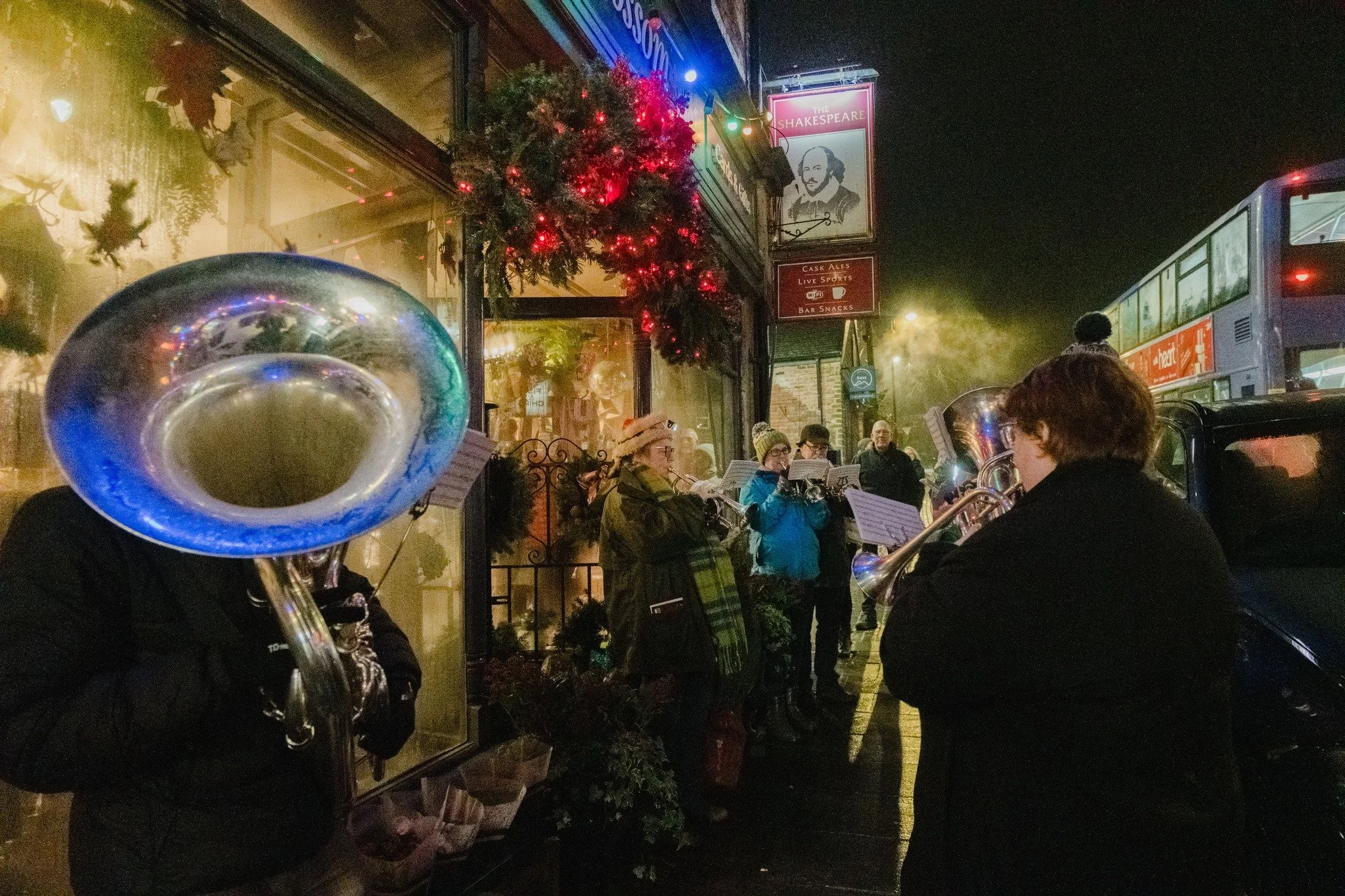 Members of the Marsden Silver Prize Band playing carols during Christmas late-night shopping in Marsden, West Yorkshire.