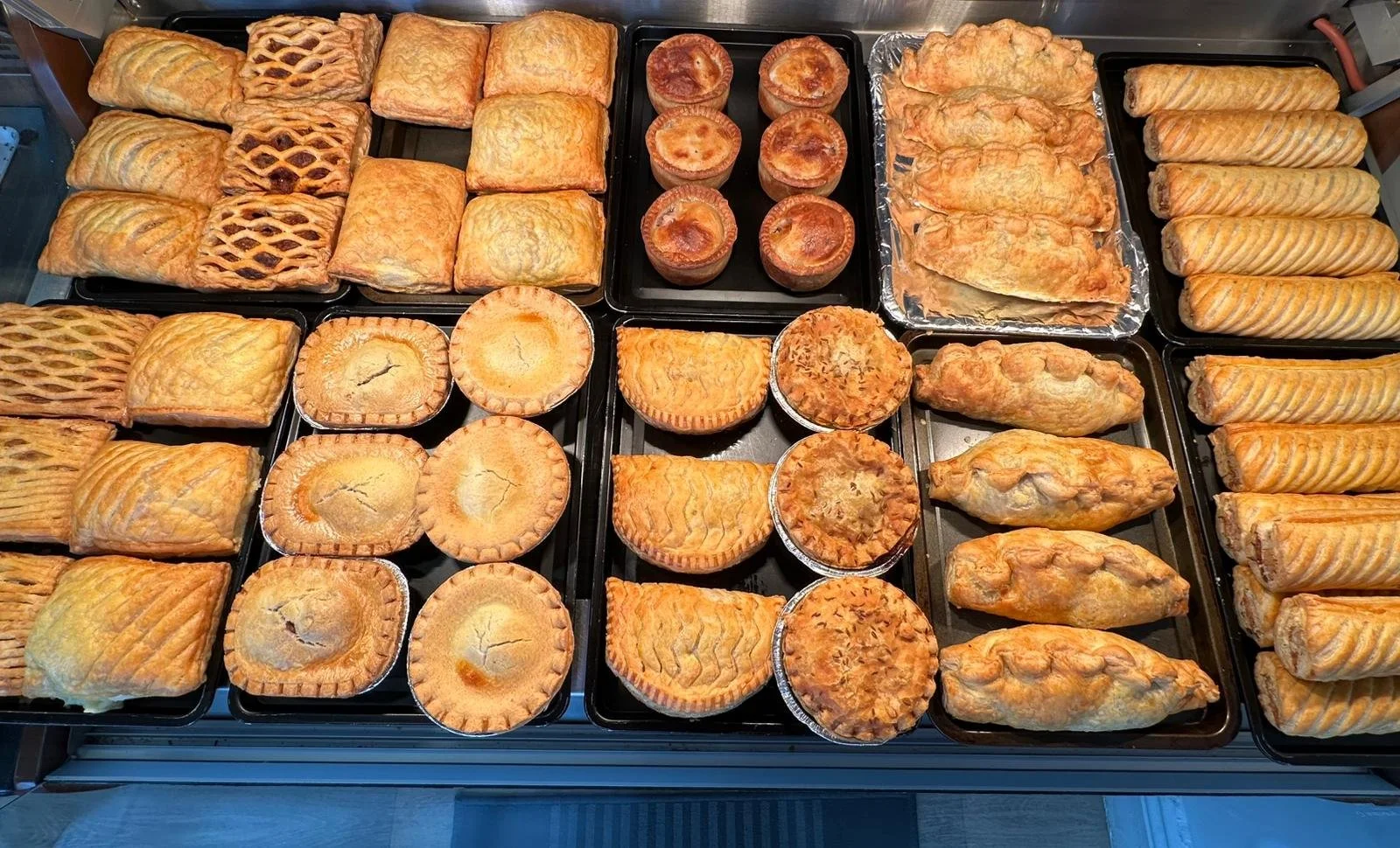 Some of the various pies and pastries sold by Mazza's Bakery in Marsden, West Yorkshire.