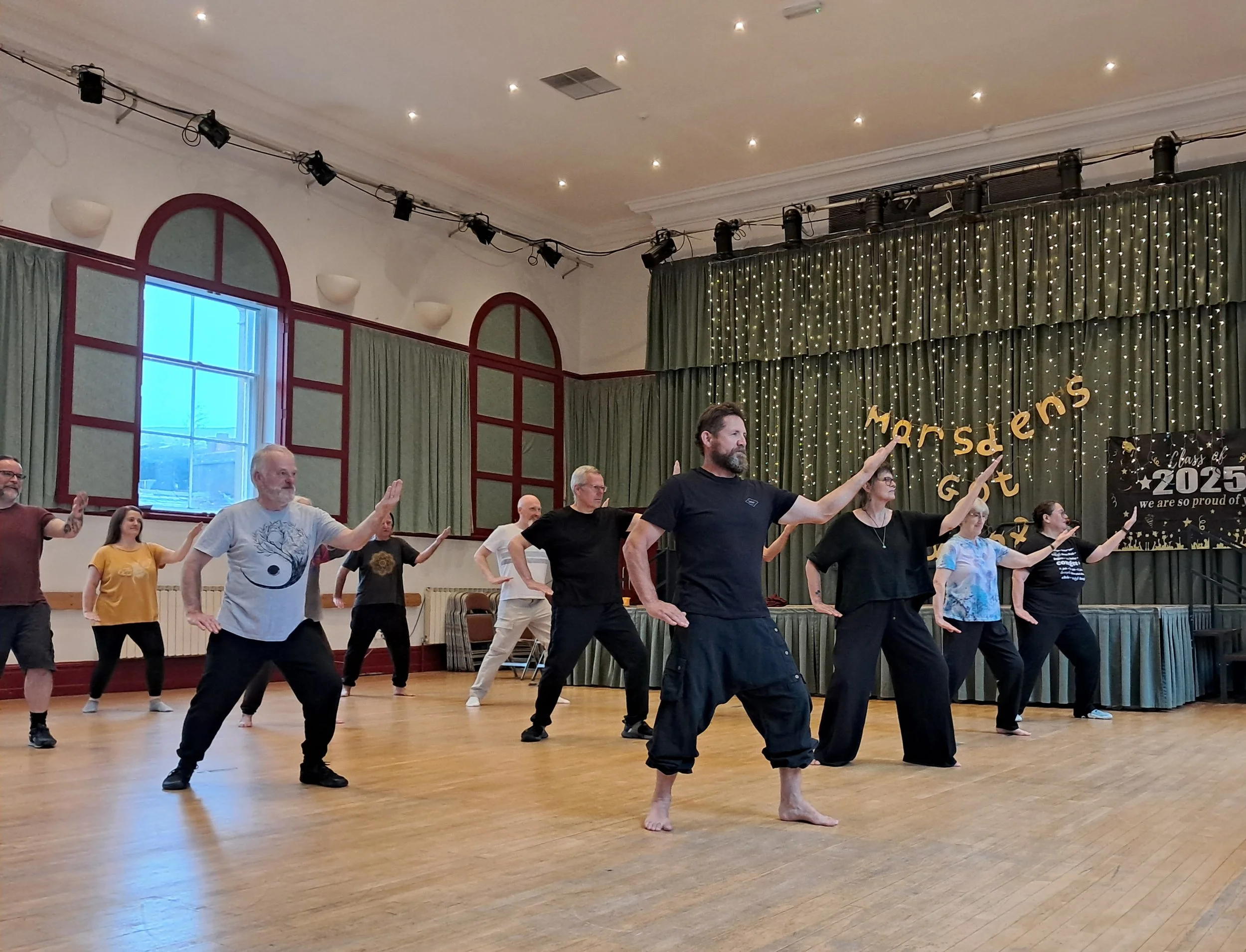 People doing Tai Chi at a class at the Marsden Mechanics in Marsden, West Yorkshire.