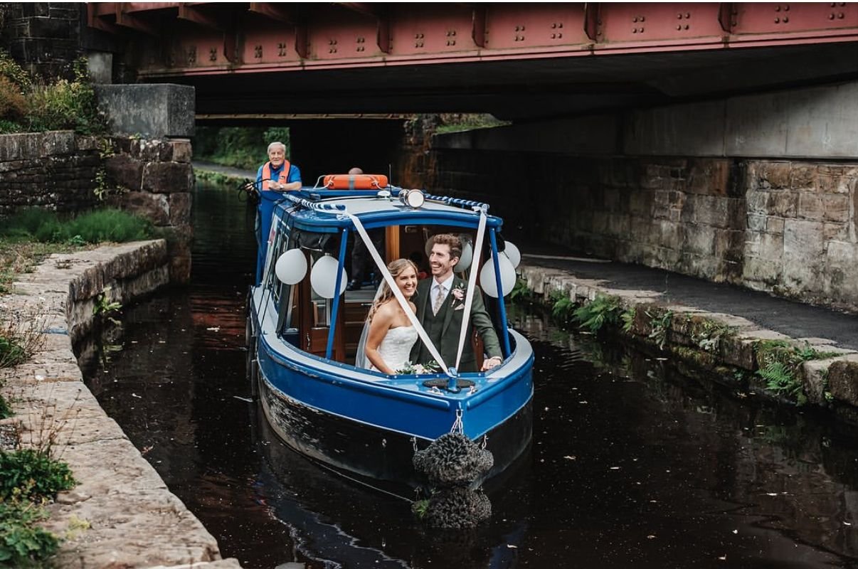 A wedding couple on the Marsden shuttle boat in Marsden, West Yorkshire.