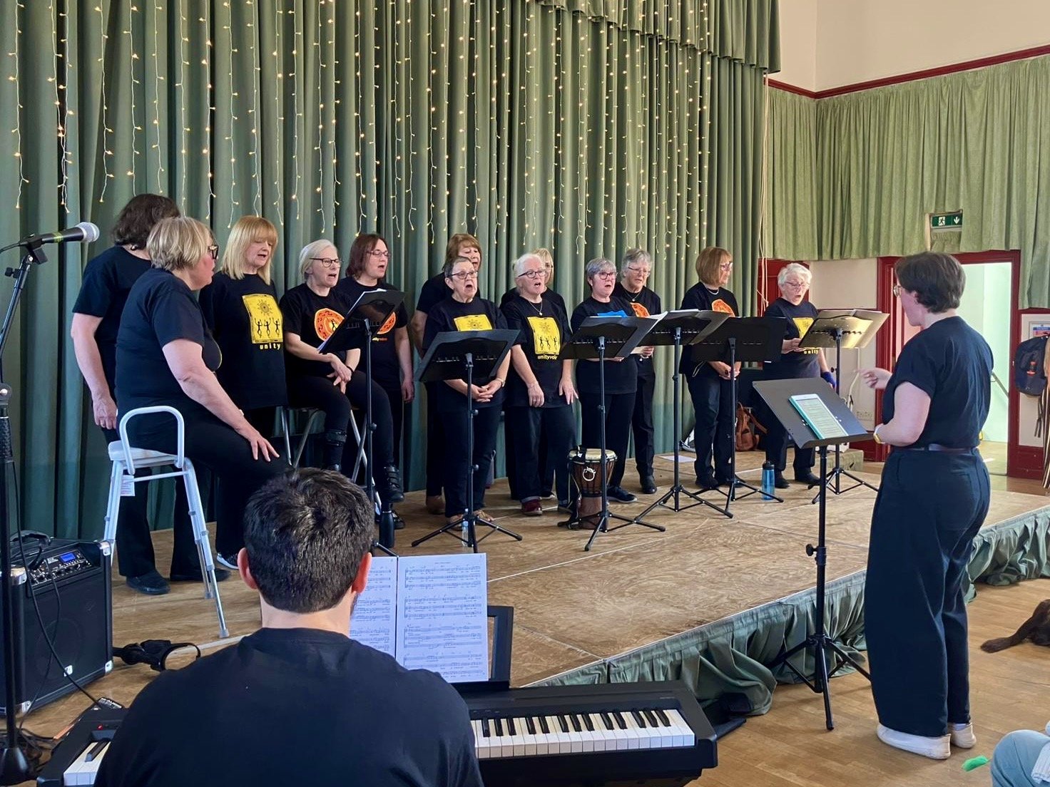 Members of Unity Voices singing in Marsden Mechanics in Marsden, West Yorkshire.