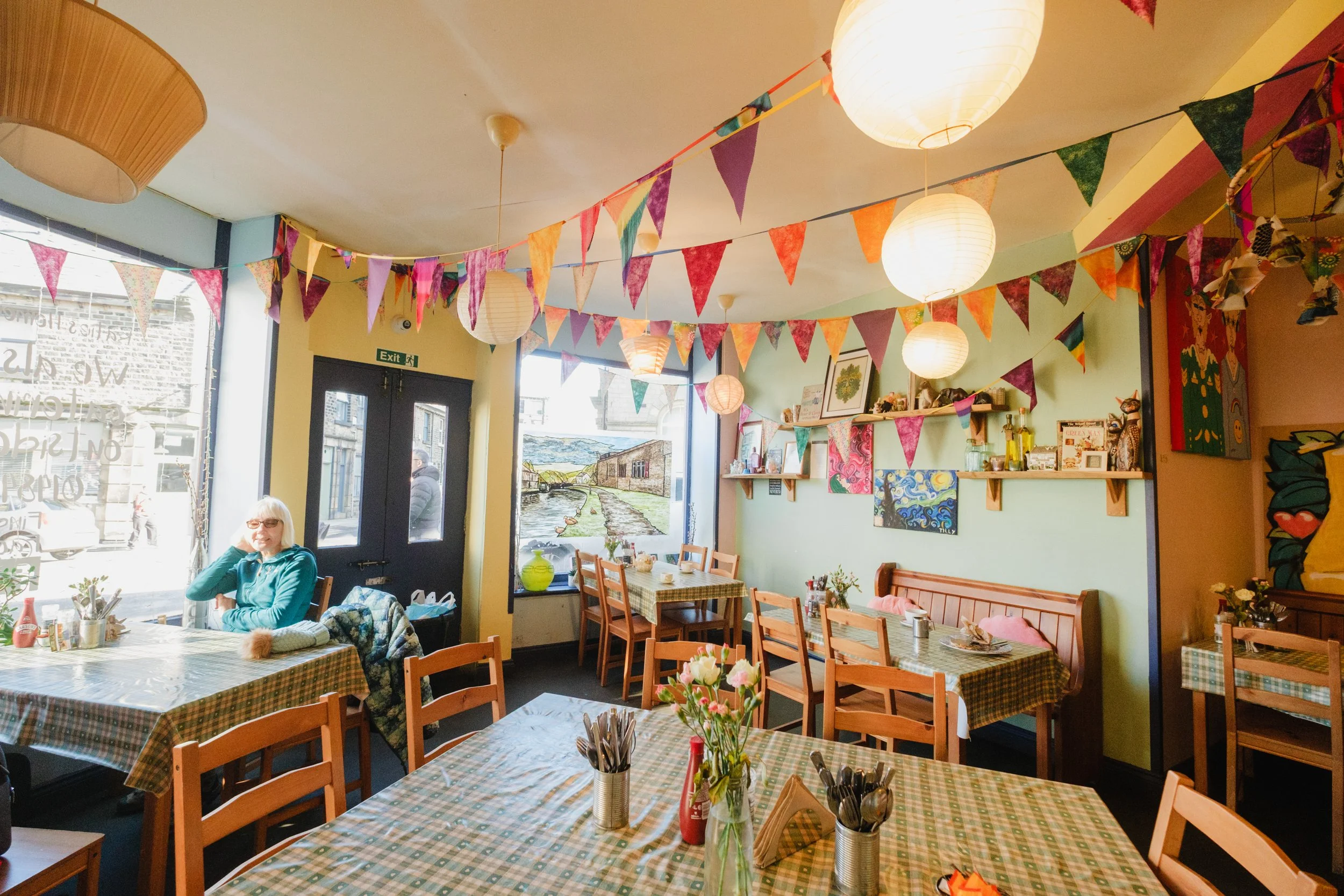 Tables and chairs in Katie's Kitchen, a cafe in Marsden, West Yorkshire.